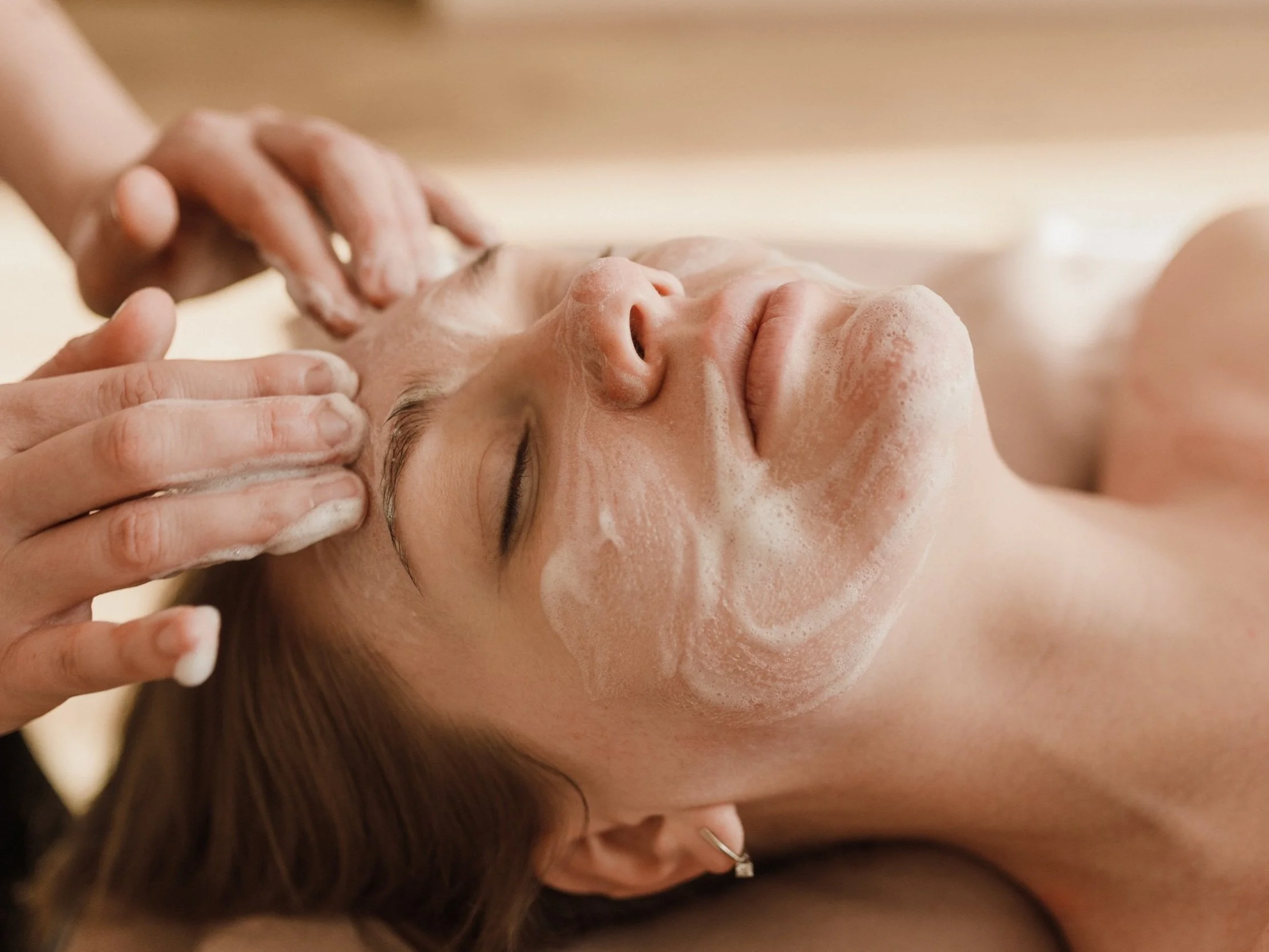 esthetician giving a facial