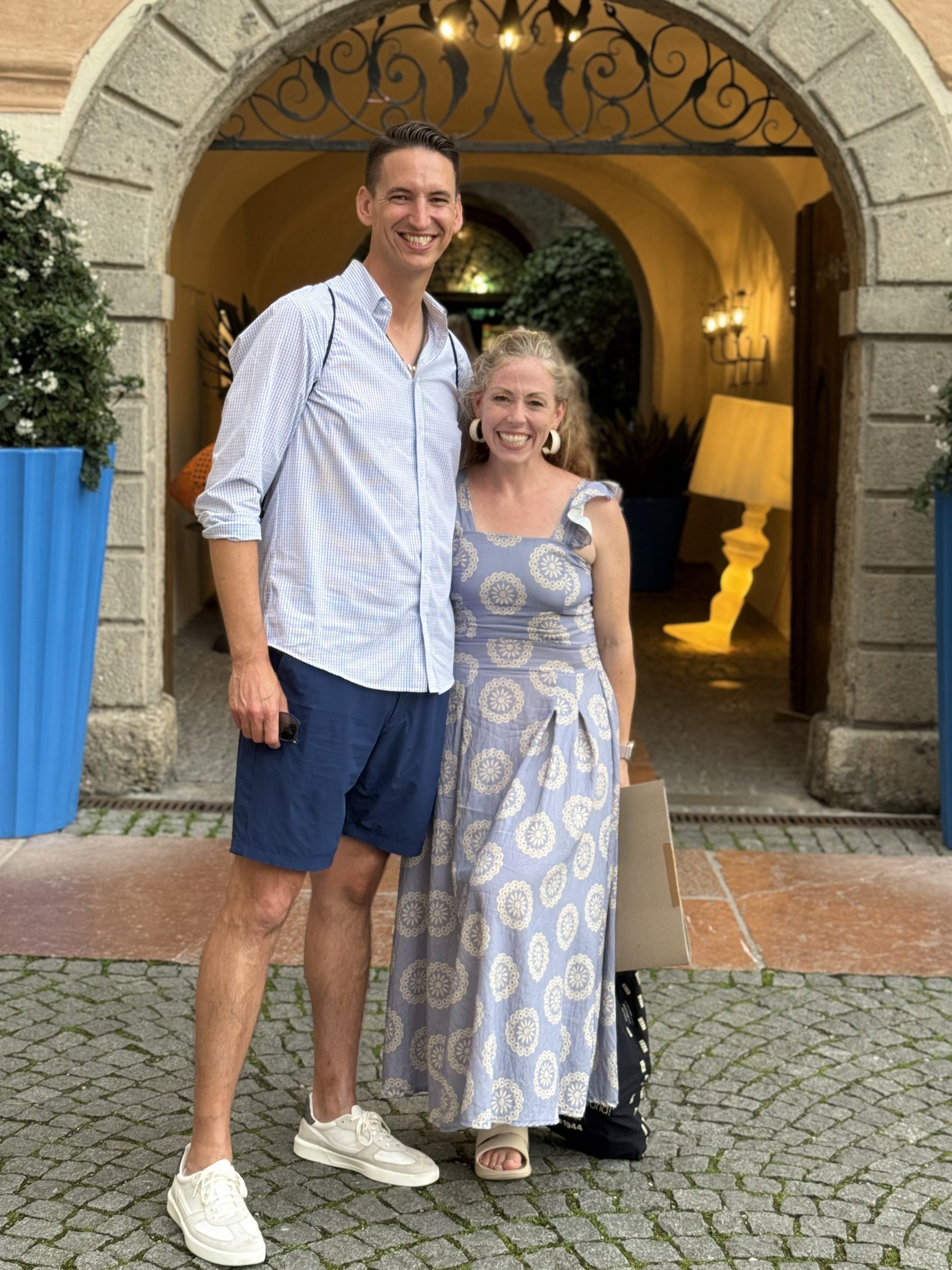 Certified Doula and photographer/videographer Nina Koehler and her husband smile outside of the longest running restaurant in Europe (started in early 800s!). This was part of a whirlwind trip including Austria. 