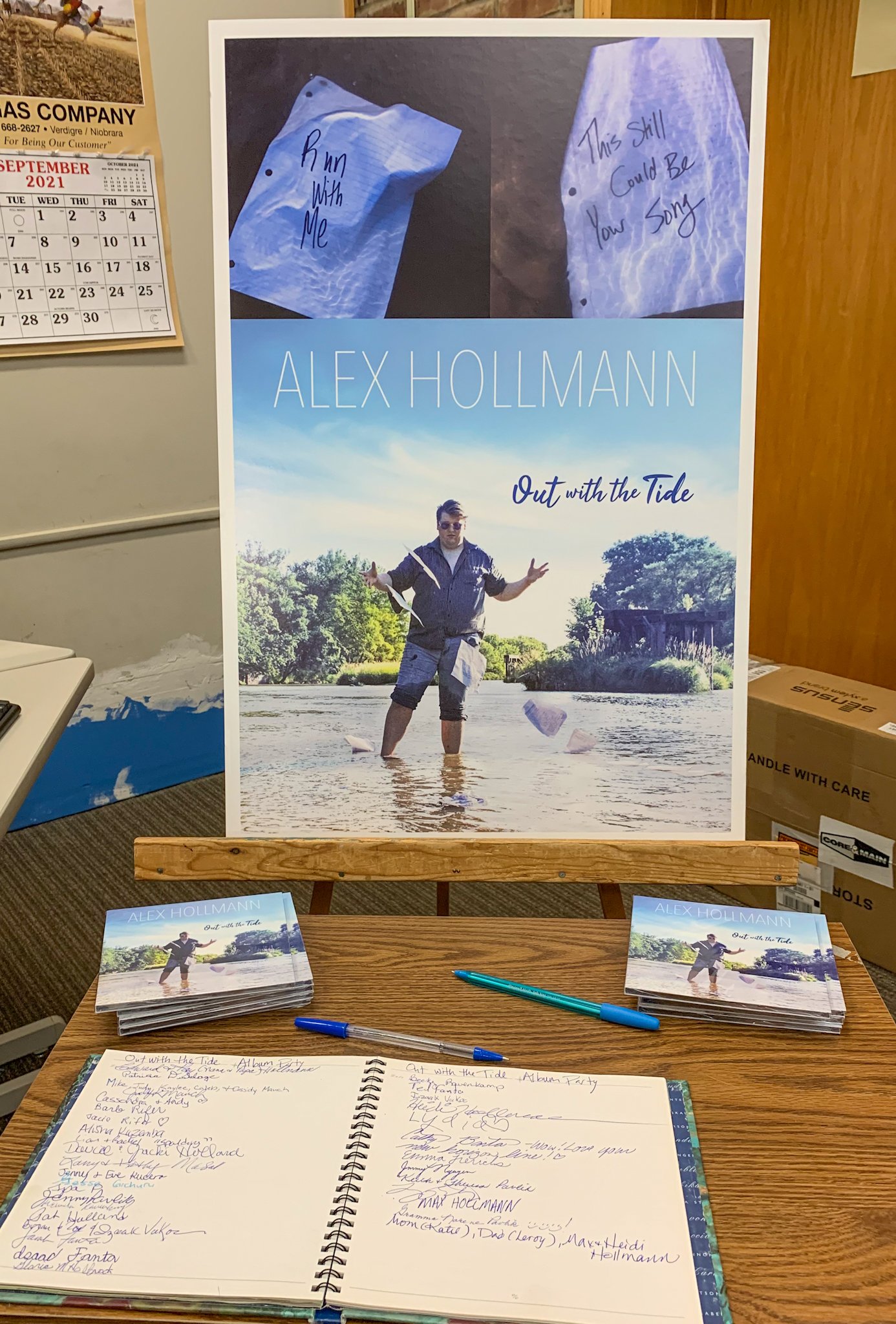 CD display, guest book, and album art poster