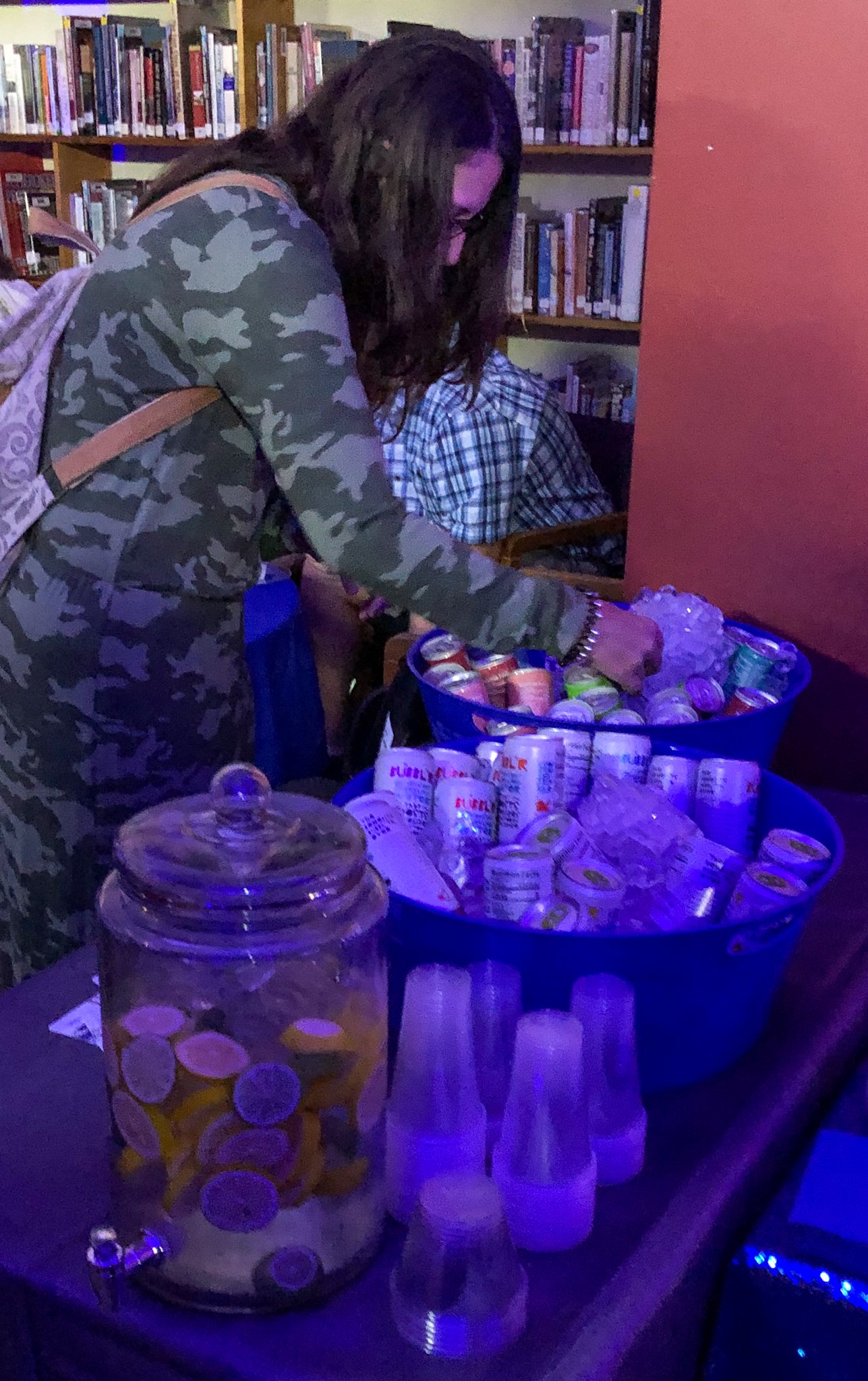 guest grabs beverages from ice bucket