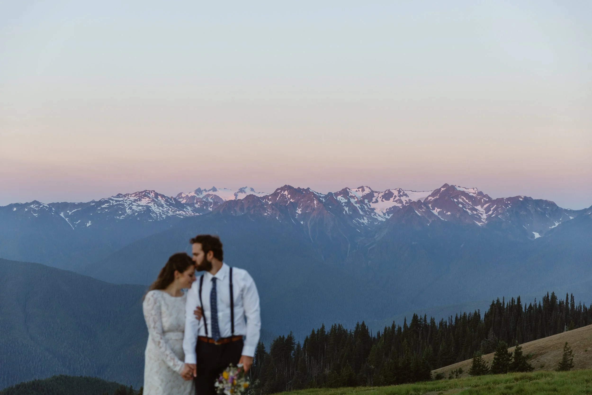 man and women eloping in the mountains