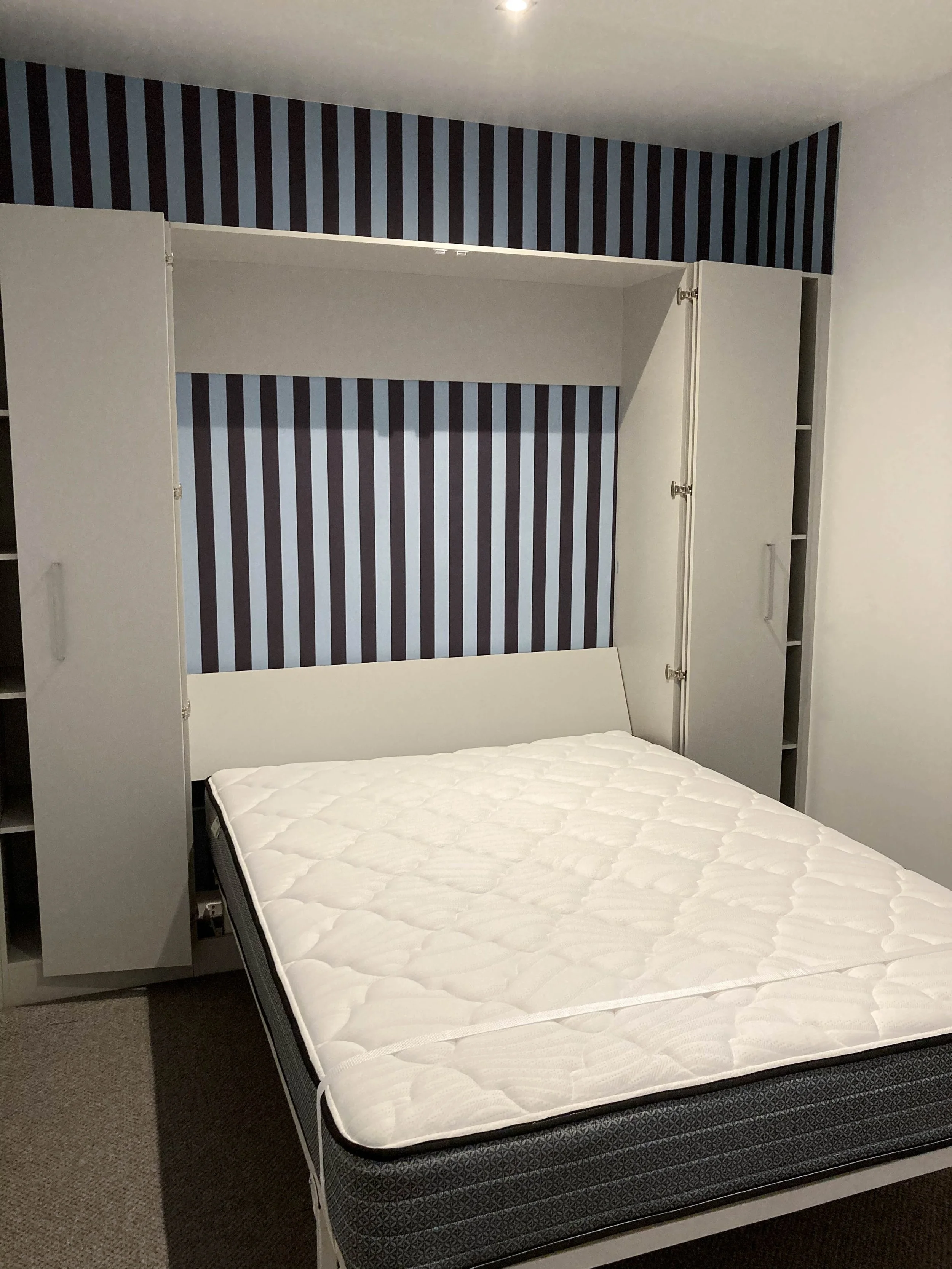 Next bed open with shelves