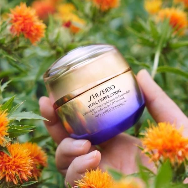 A hand holiding a Shiseido Eye Cream product