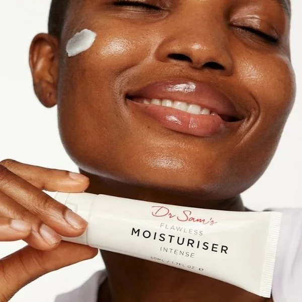 Woman holding Dr. Sam's moisturiser intense