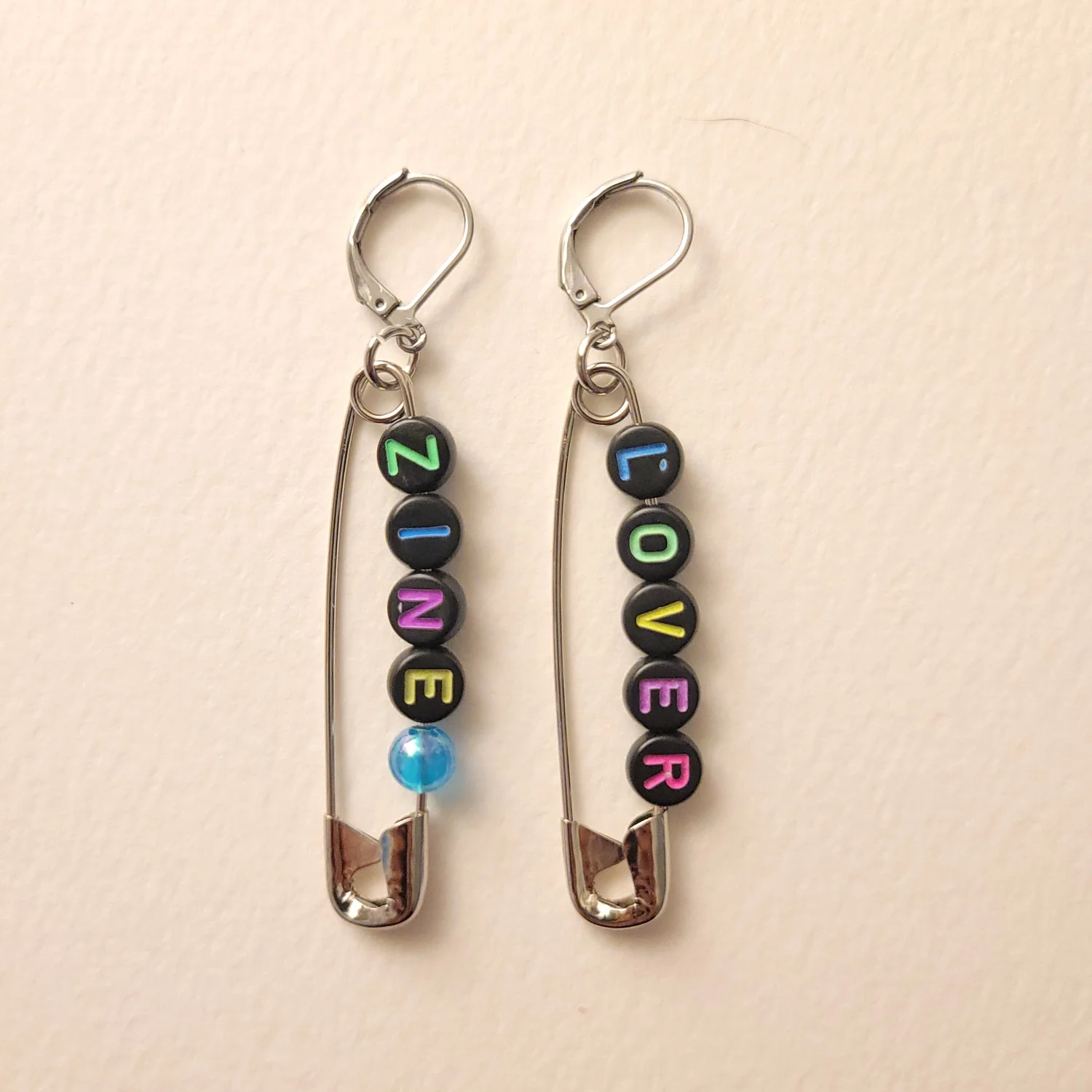zine lover safety pin earrings