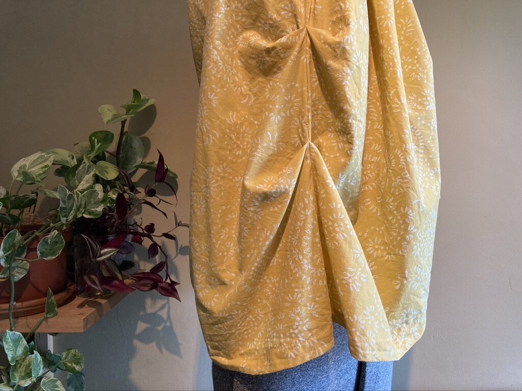 Side Pleats on Flared Silhouette