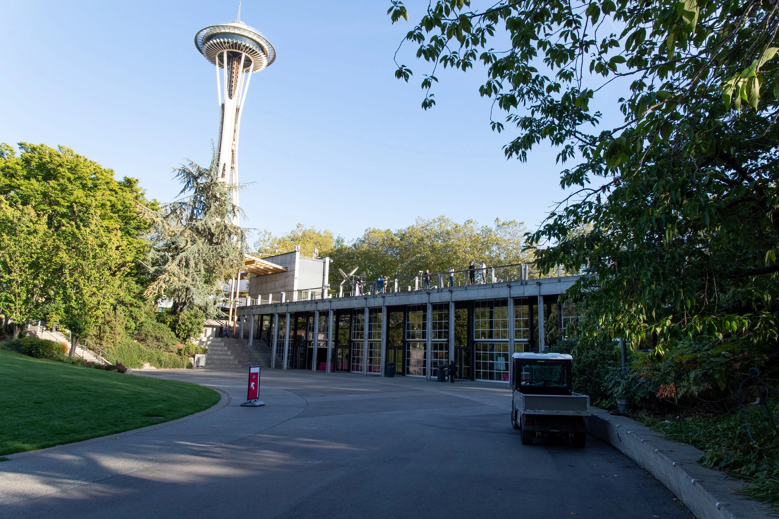 A wide shot of a venue low-floor building from outside where we can see the Space Needle as its background.