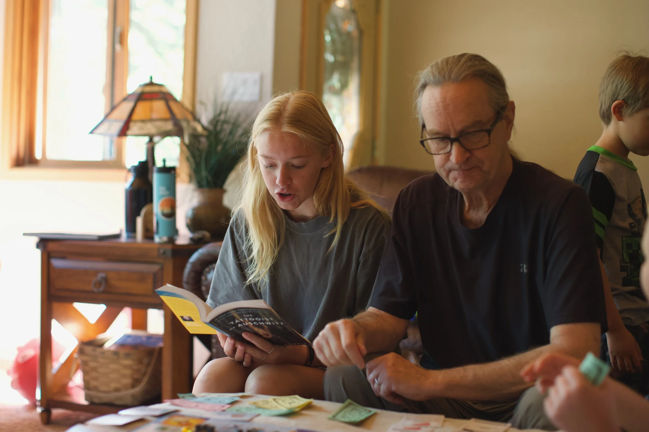 A Young Lady Reads to Her Grandfather