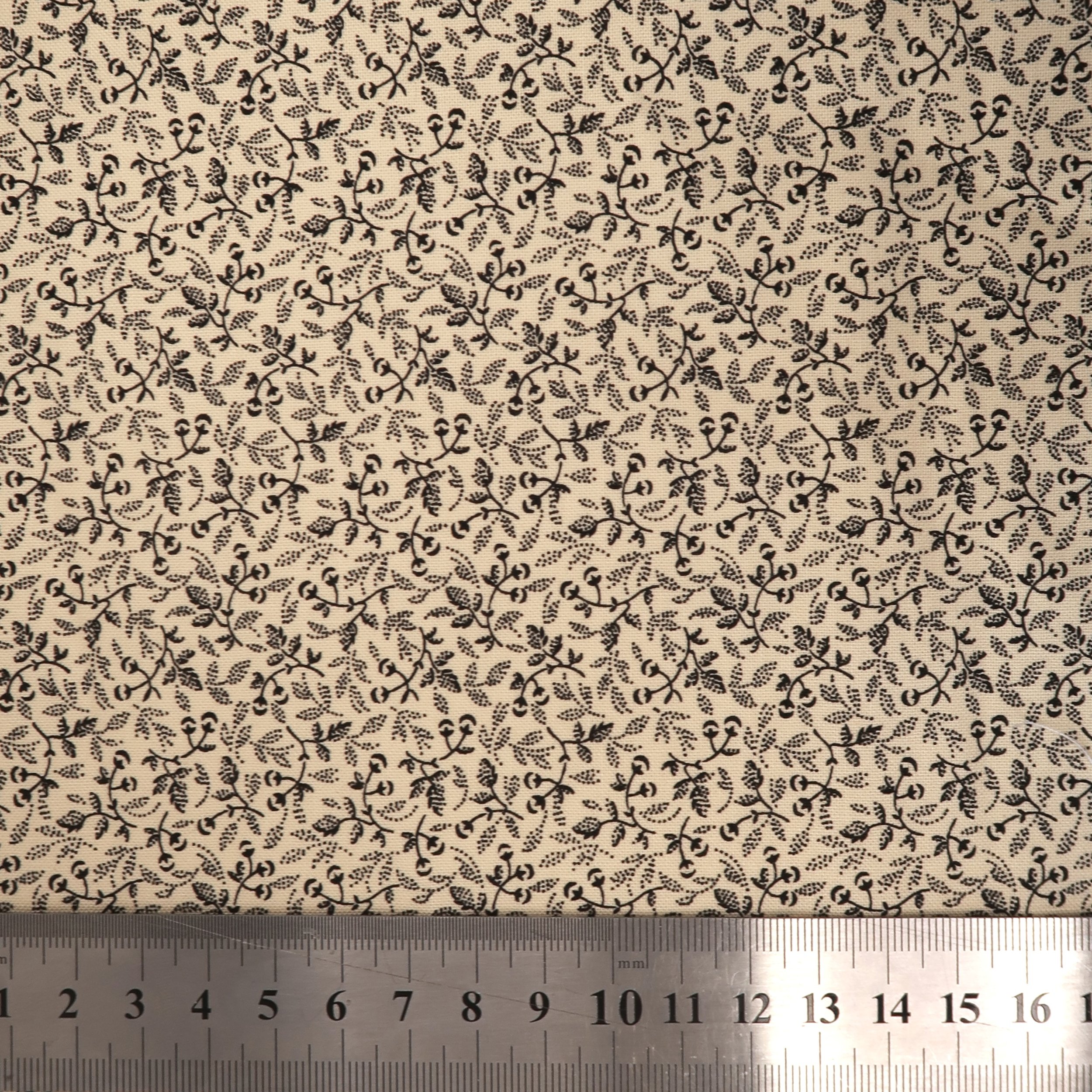 Beige with black buds and leaves fabric