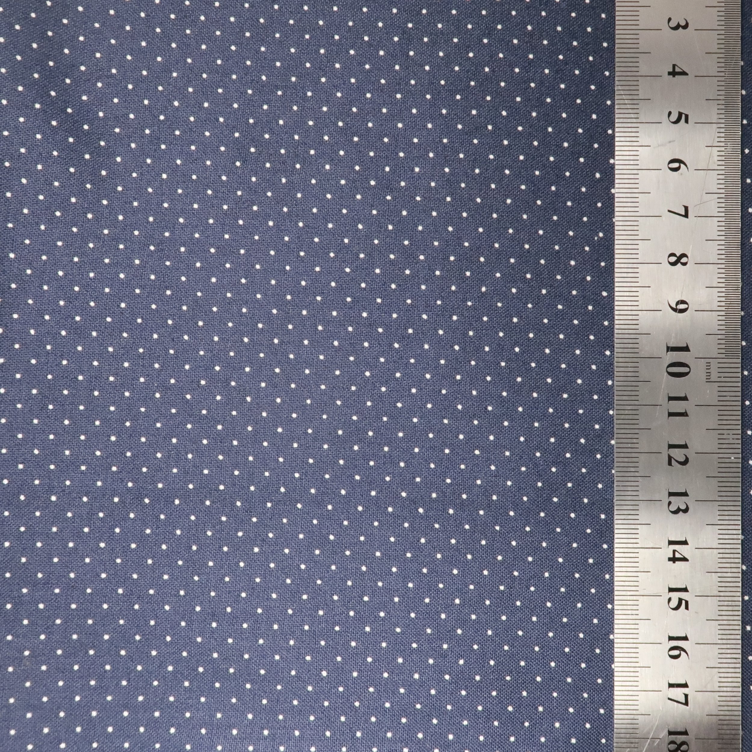 Tiny white dots on navy fabric
