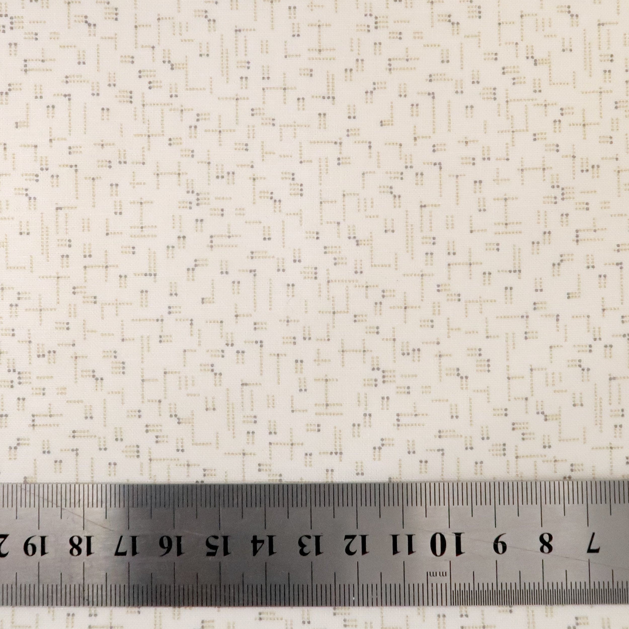 Tiny dotted lines on ivory fabric