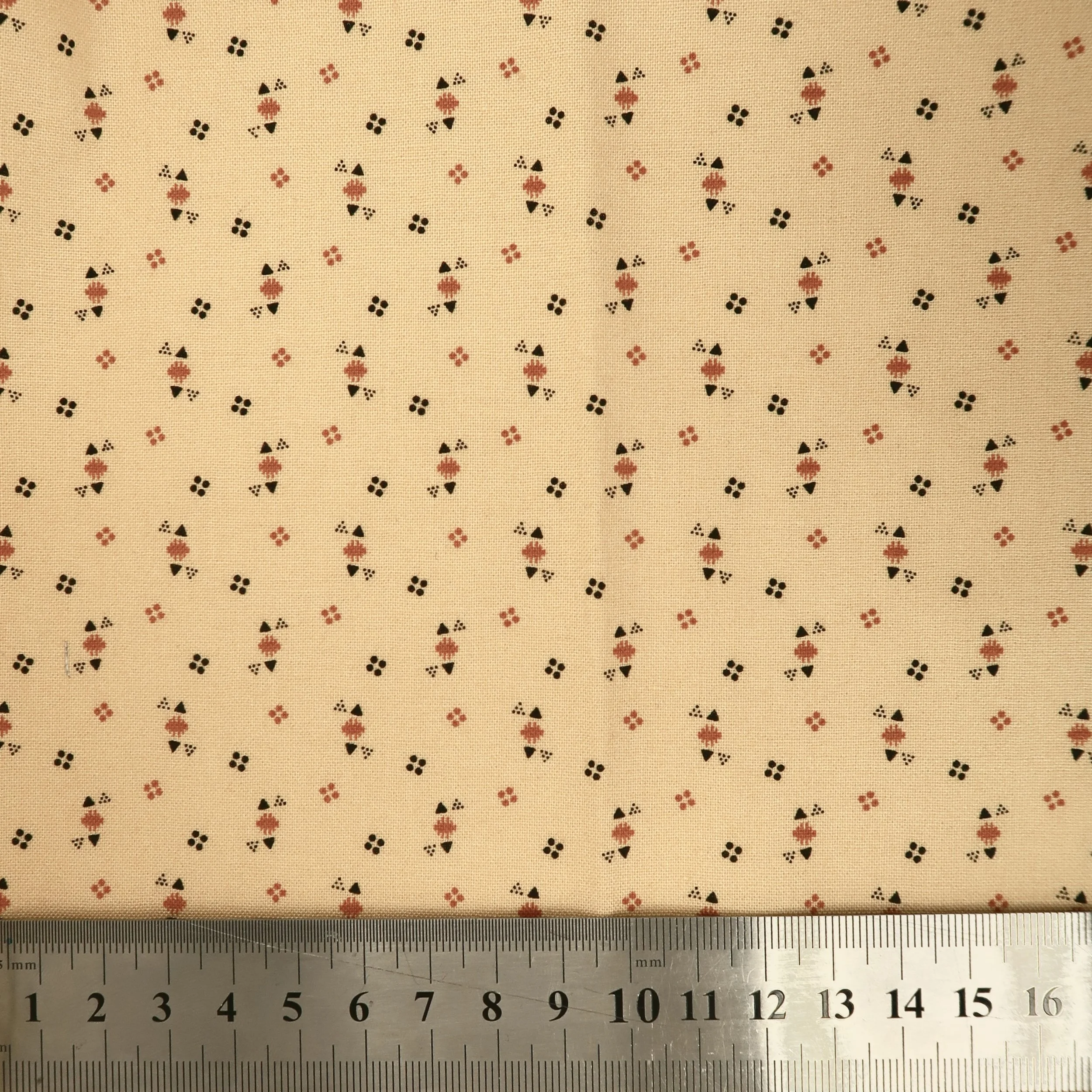 Dark cream triangles and dots fabric