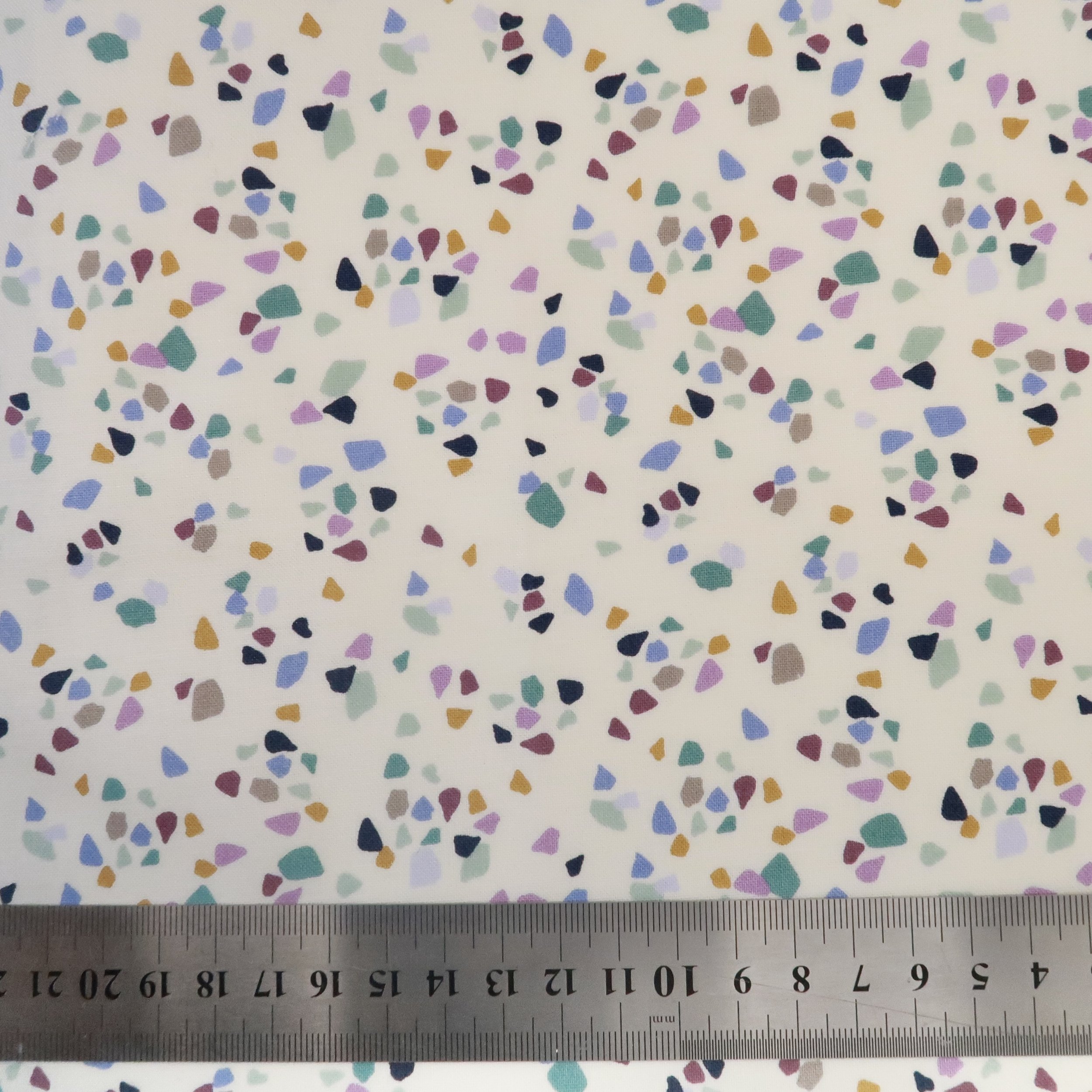 Teal and lilac sea glass on ivory fabric