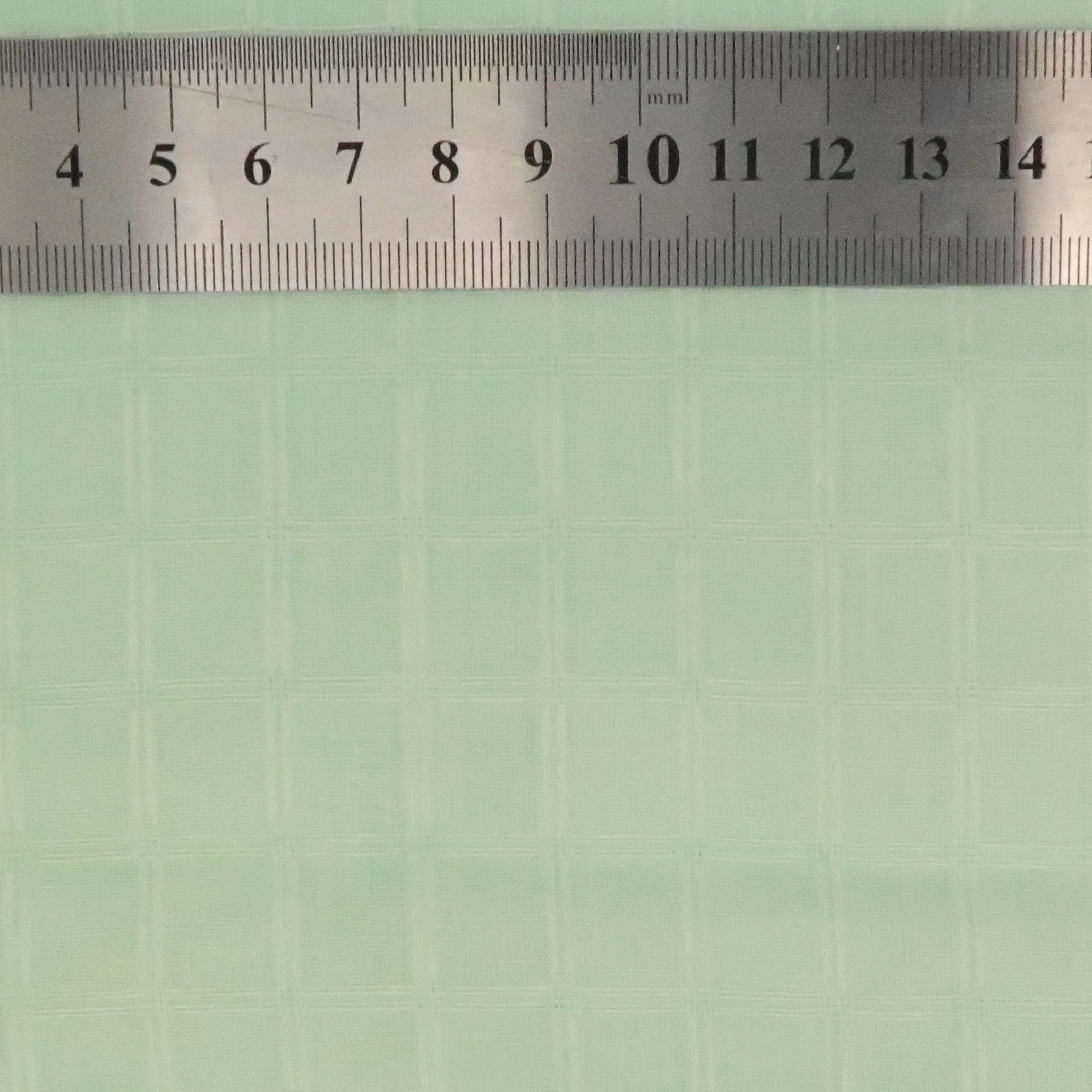 Pale apple green cotton woven check fabric