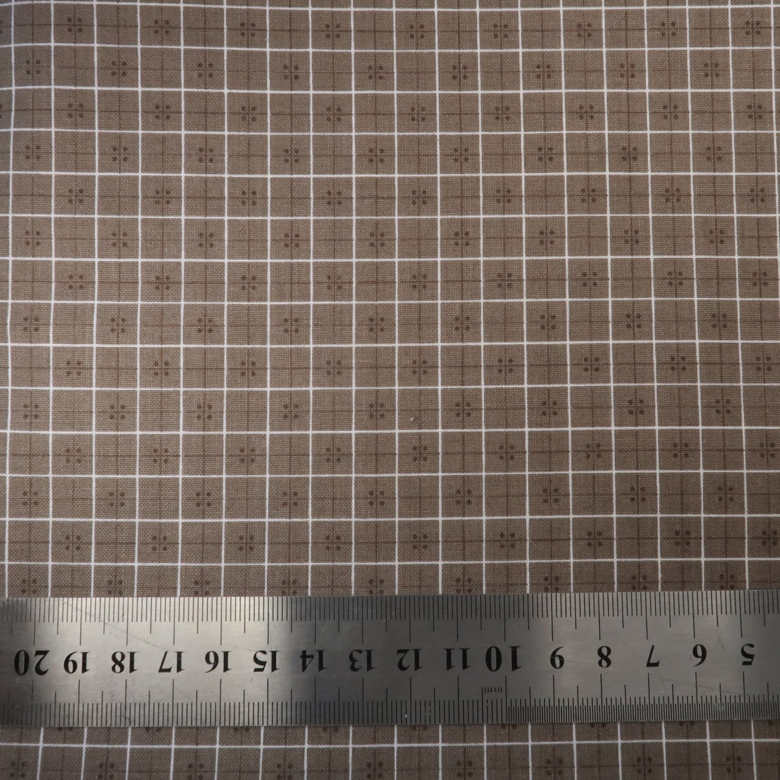 White plaid and dots on taupe grey fabric