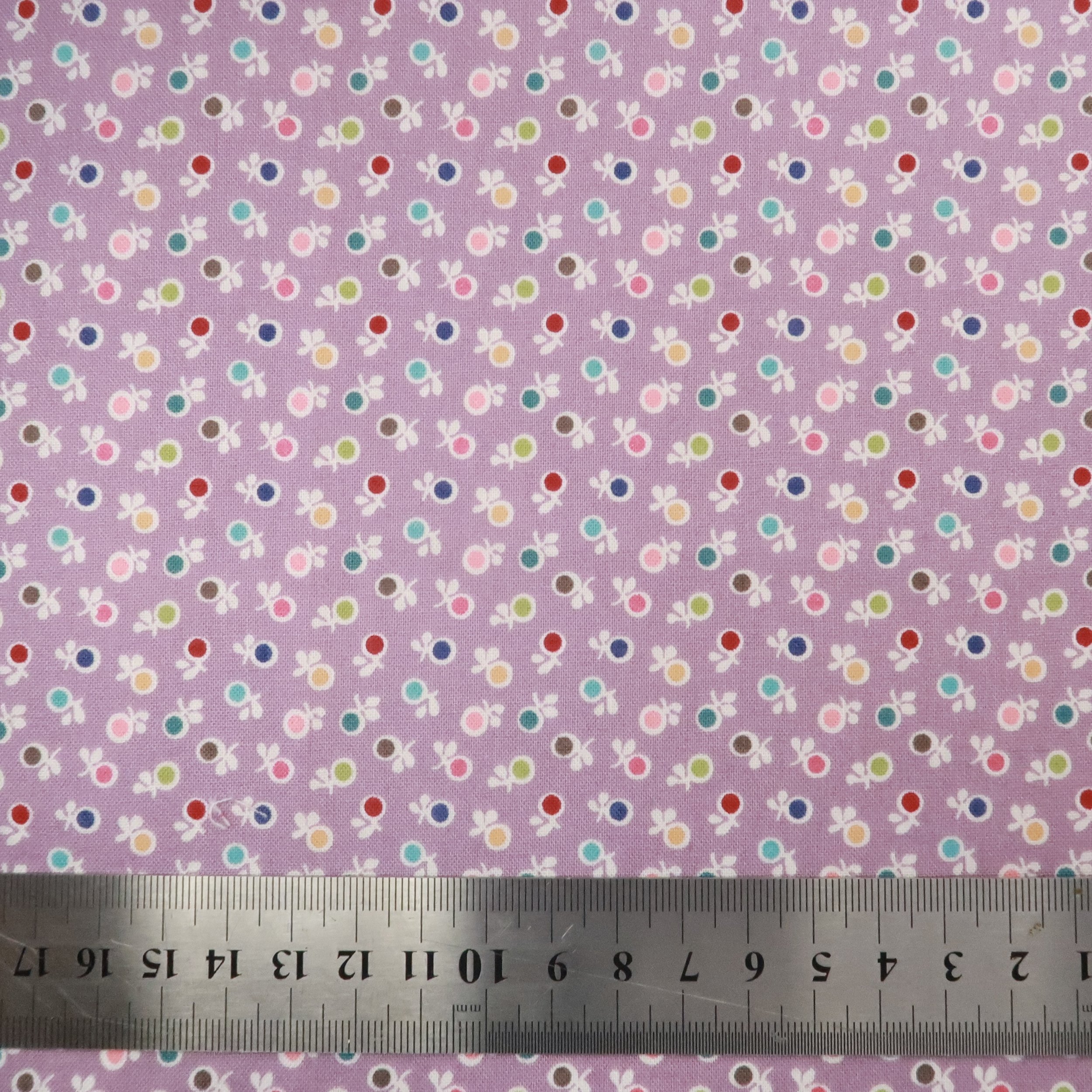 Multi spot flowers on lavender fabric