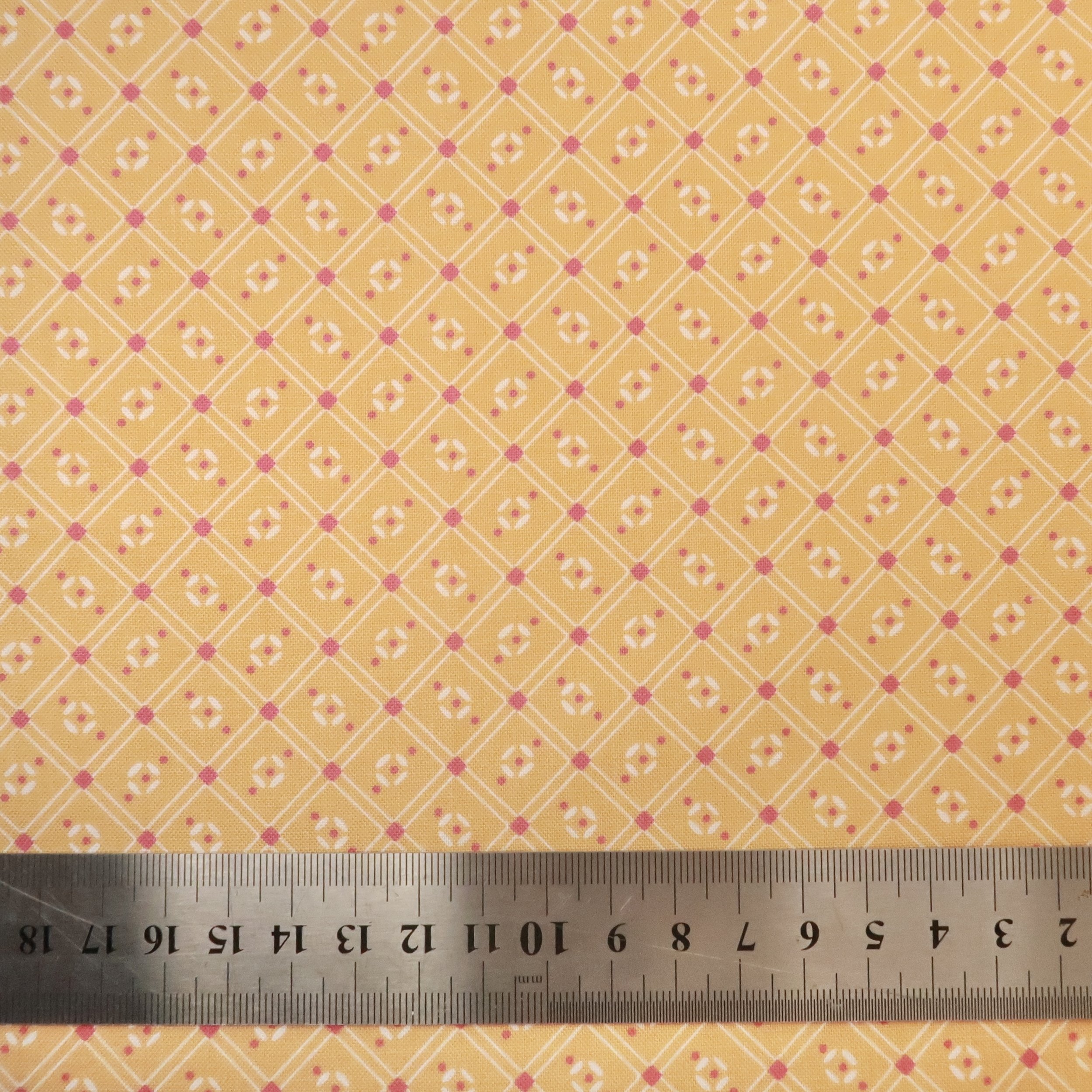 Pink and white lattice on orange fabric