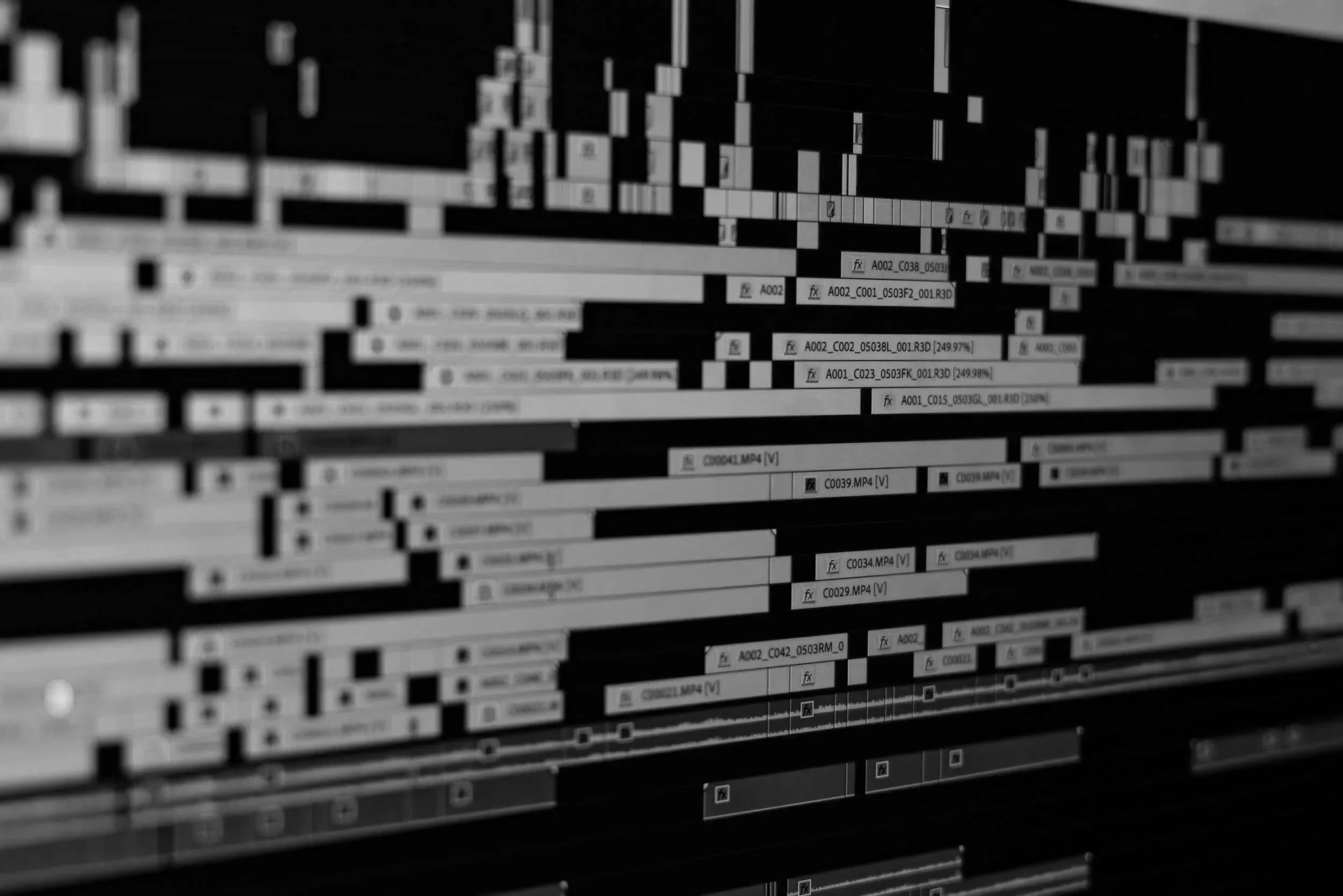 Screenshot of a video editing timeline with multiple tracks, clips, and editing elements.