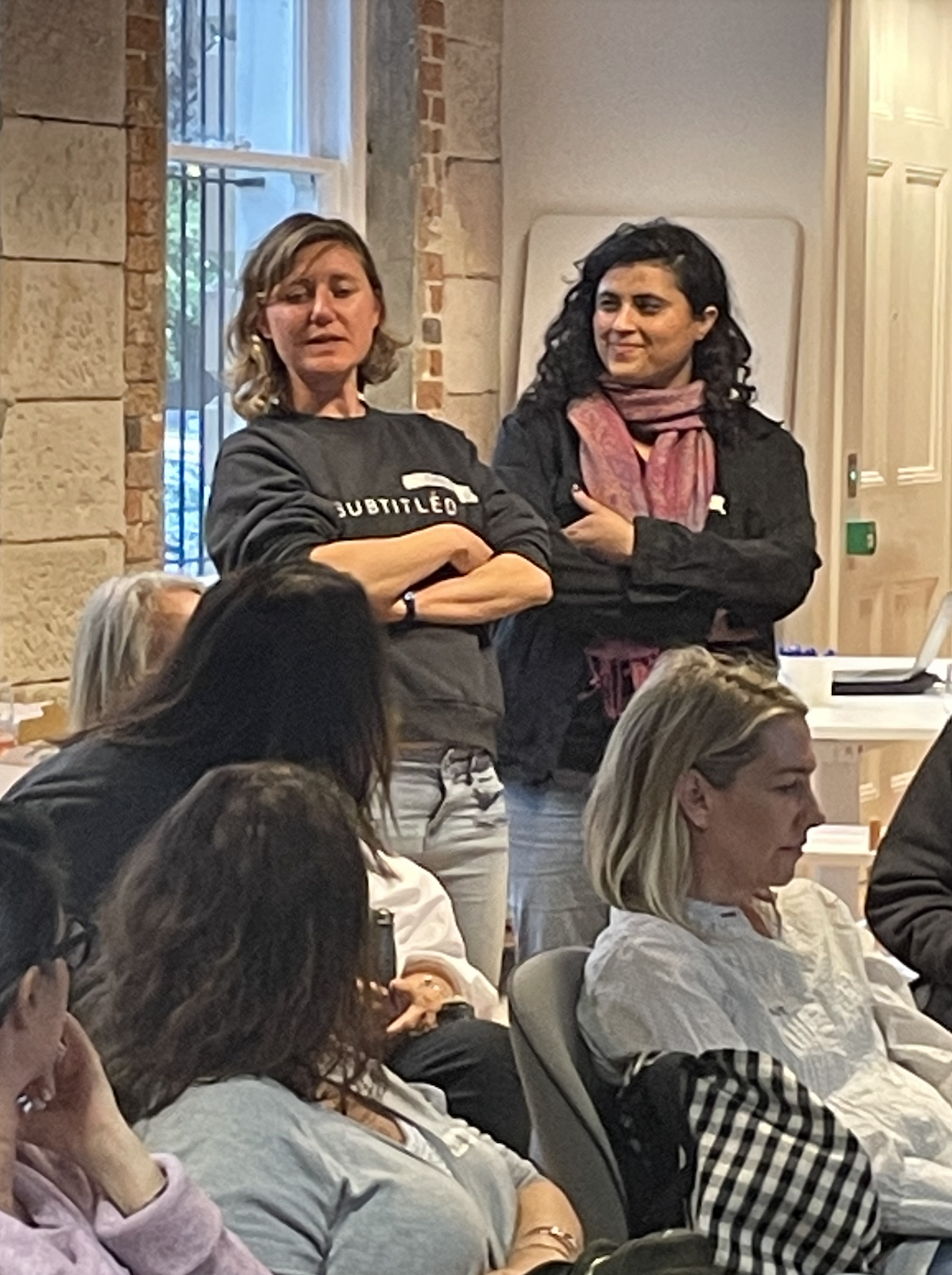 Volunteers with arms crossed posing for photo
