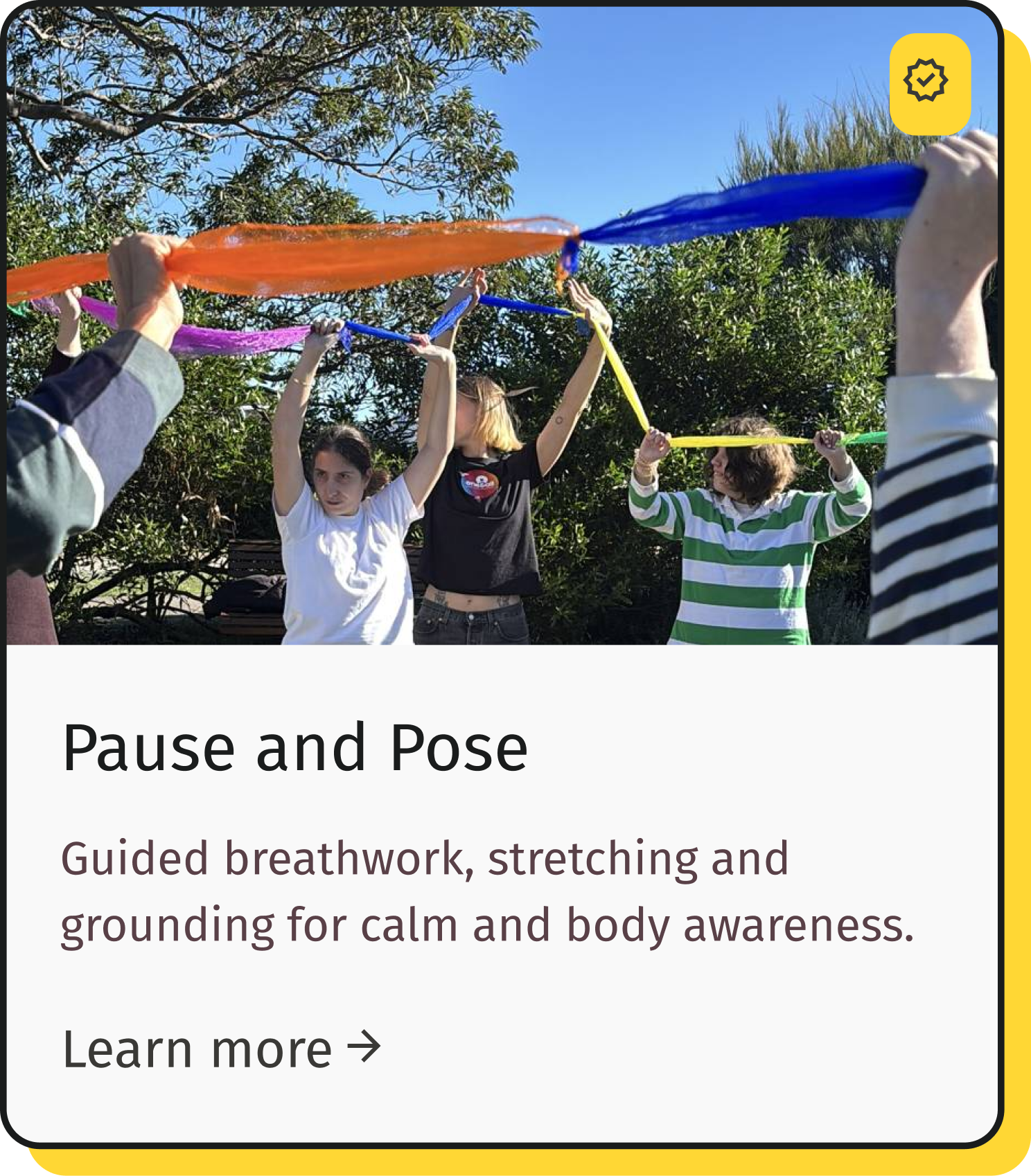 People practicing guided breathing exercises outdoors, holding colorful scarves and possibly stretch bands, with trees and blue sky in the background.