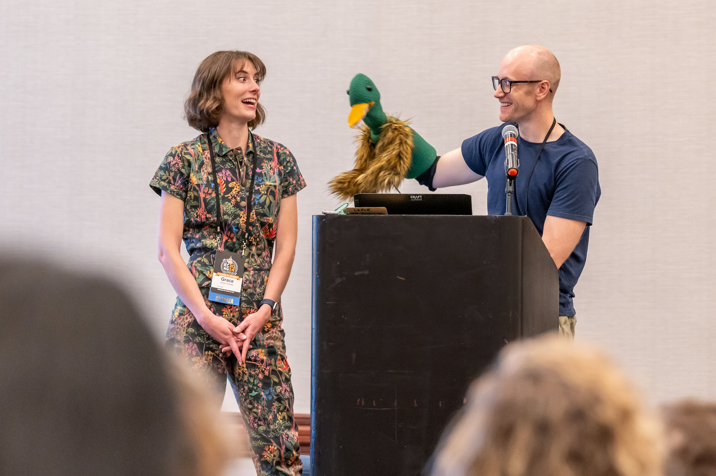 Grace Townley and Spencer Lott presenting at an event