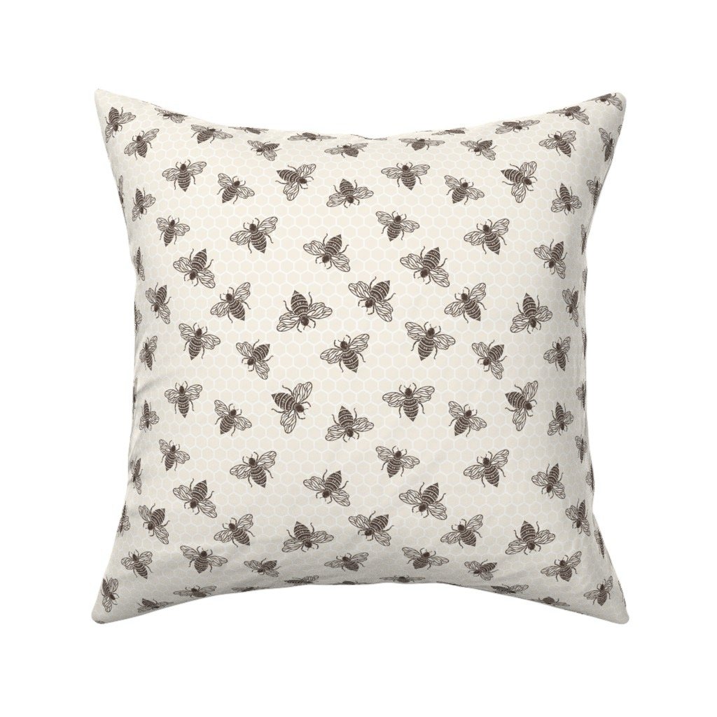 scatter-cushion-with-bees-on-honeycomb-tecture