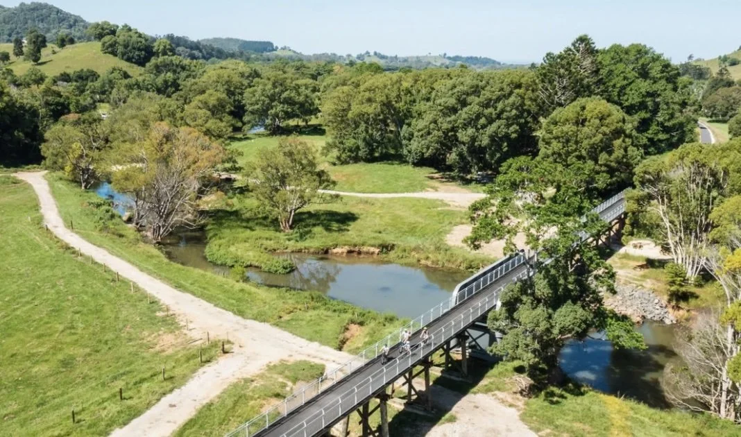 bike and walking path across a bridge through the green countryside