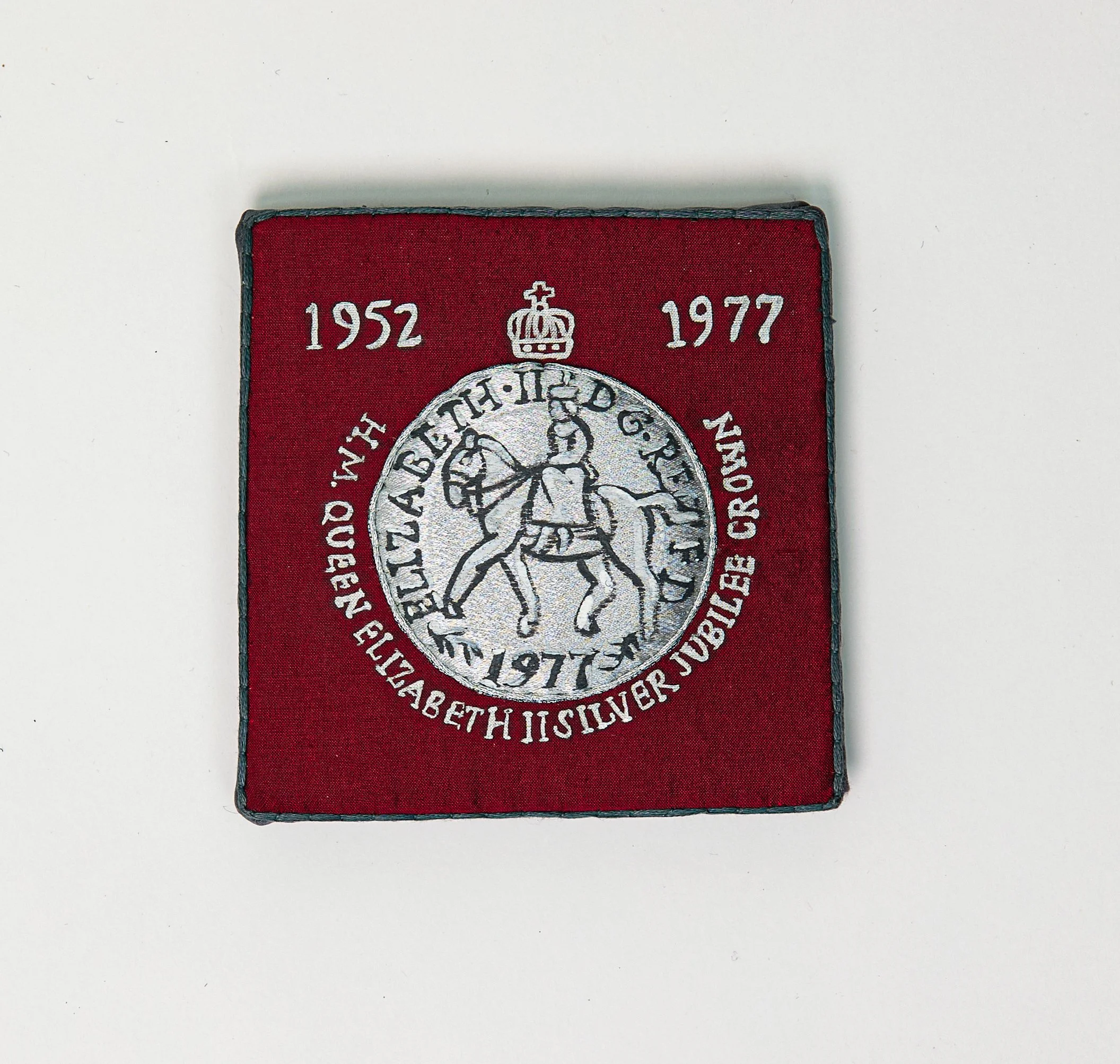 "Lee's Jubilee Coin" (2025), hand-embroidered and hand-painted silk and other textiles, 11.5cm x 11cm x 1.5cm, £150