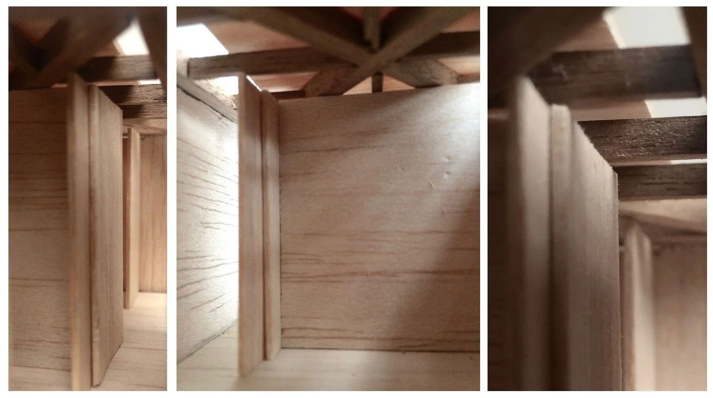 Close-up of wooden furniture components showing stacked wooden panels and supports.