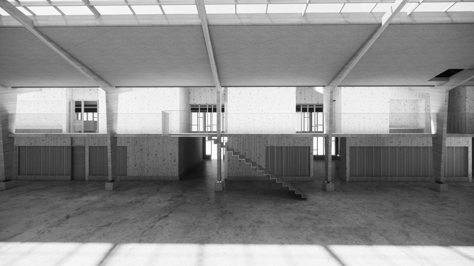 Interior view of a modern, unfinished building with concrete floors, wooden panel walls, and open upper balconies with railings. Central staircase leading to the upper level, with large windows allowing natural light to fill the space.