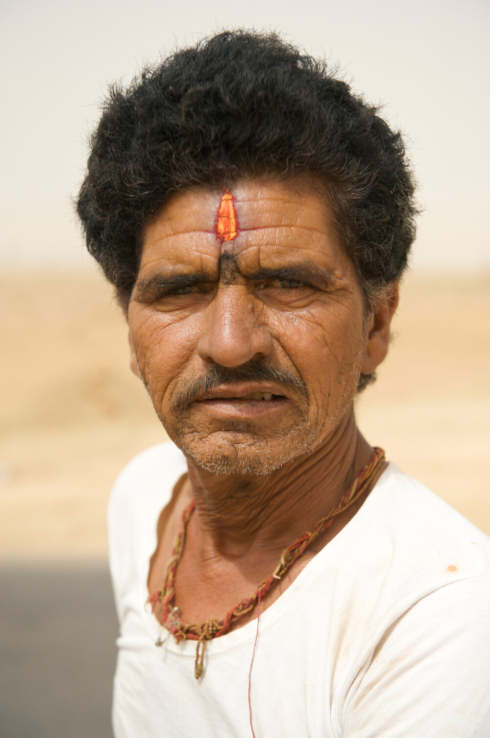  Day laborer commuting in a sandstorm - Rajasthan, India 