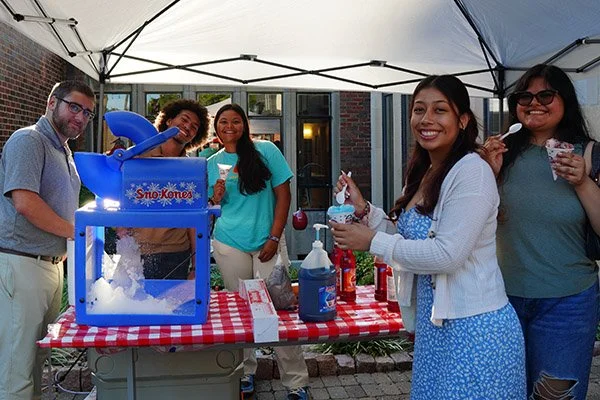 Students making snow cones at the 2025 Welcome BBQ