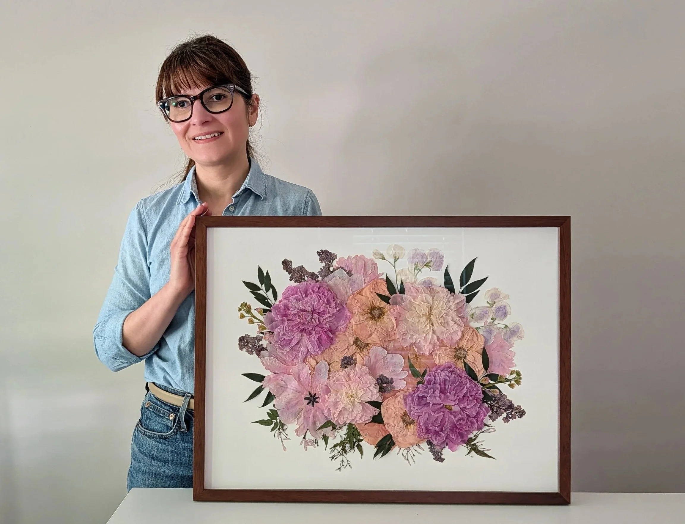 Preserved bridal flowers in a frame