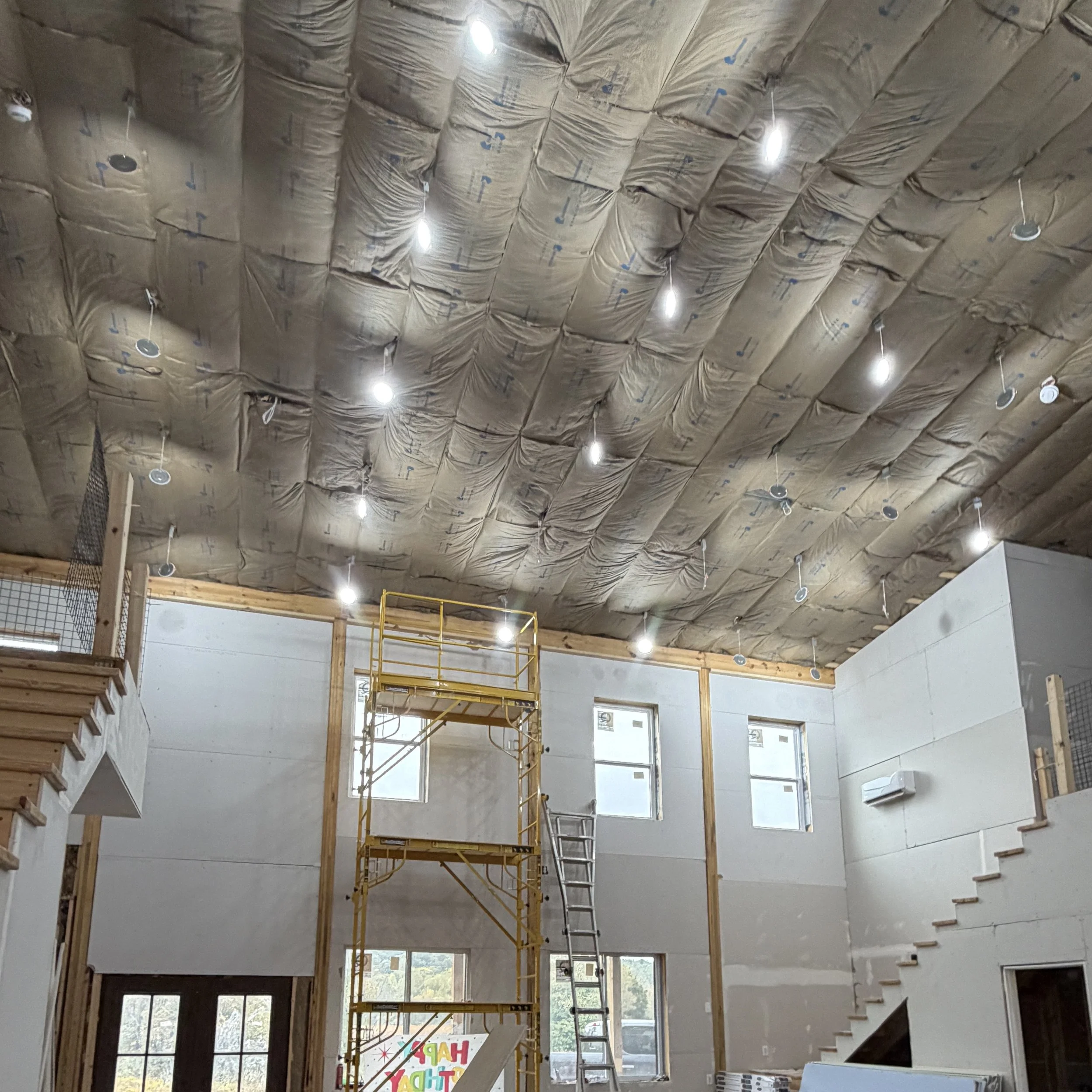 Drywall hung 20 feet high on the walls of a custom great room under construction in Leitchfield, KY