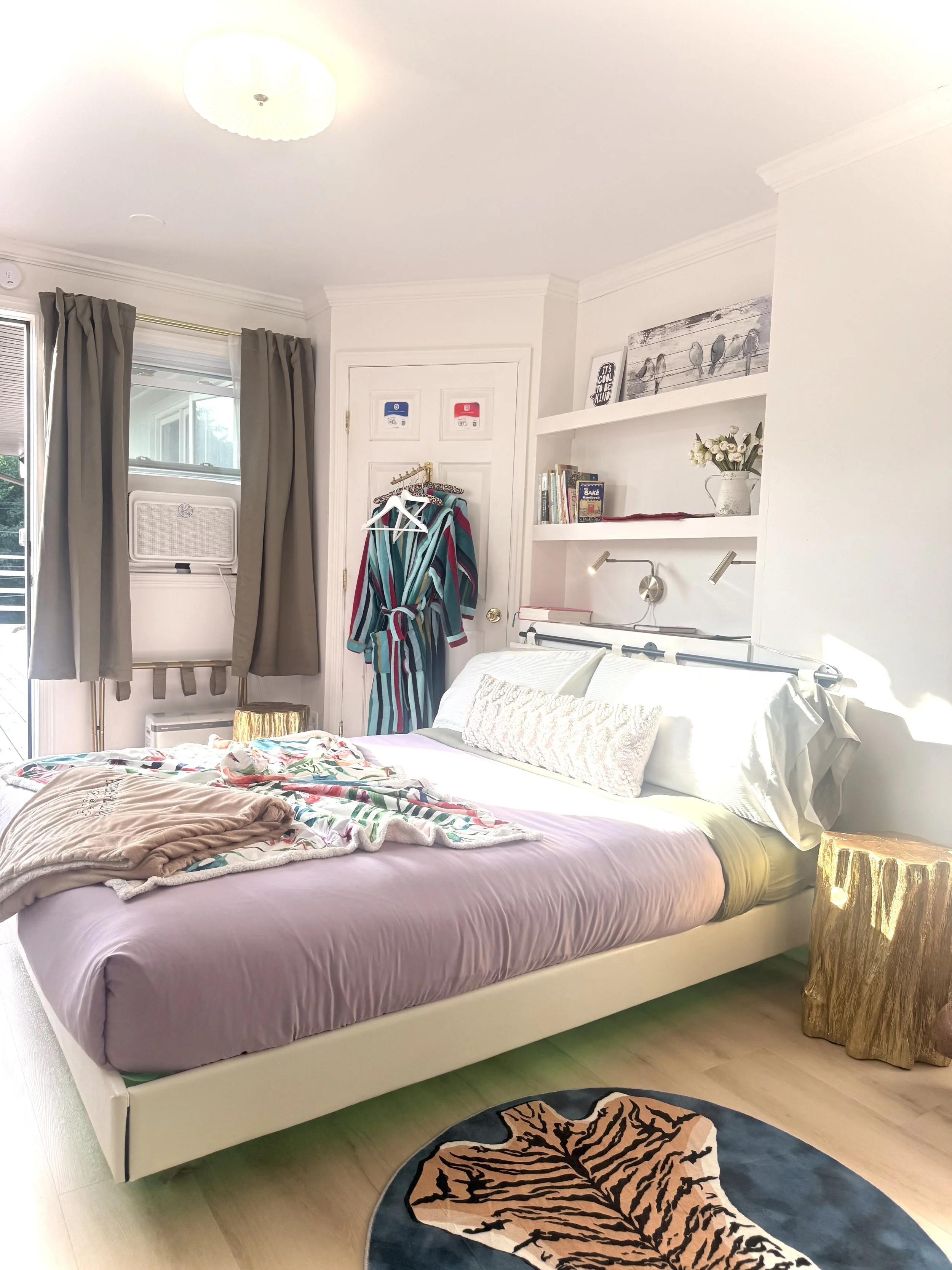 🛏️ Soft linens, cheerful colors, and a cozy bed made for restful nights after a full day in the Catskills. ✨