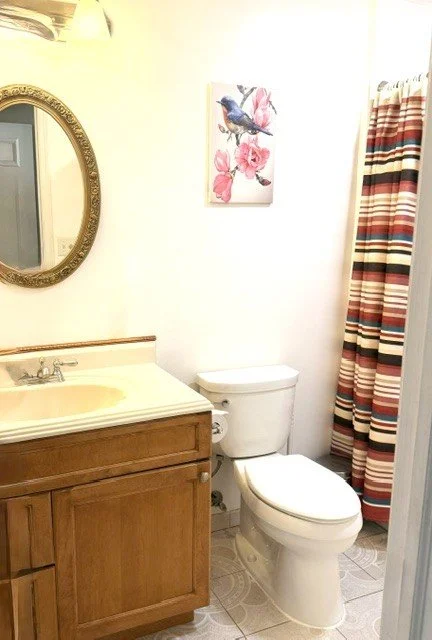 Fresh and inviting bathroom with warm wood accents,