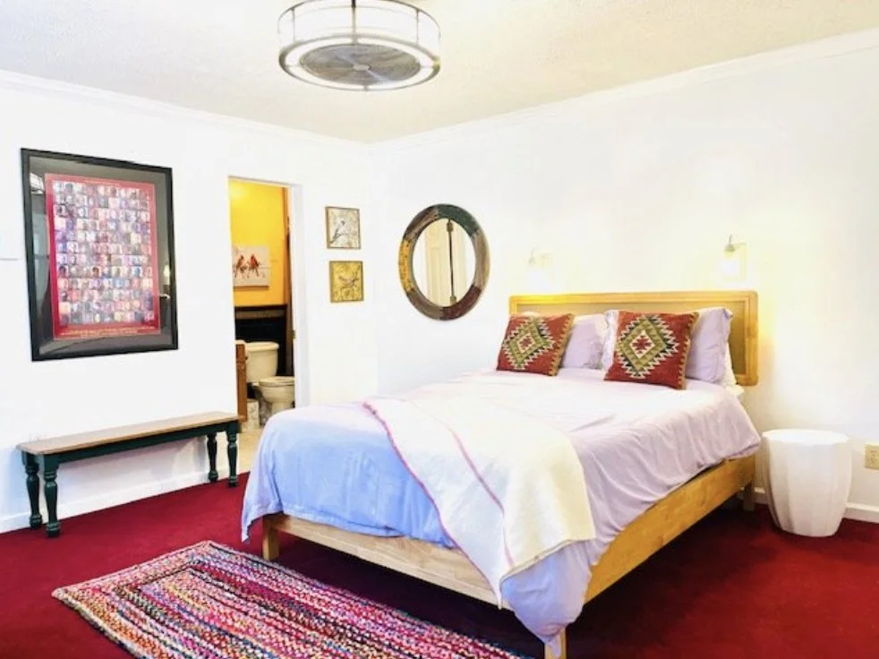 Photo of bed in Alpine 4 Seasons lodging.