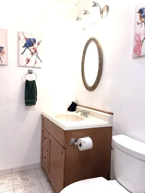 Bright and spotless bathroom with cozy touches, warm lighting, and fresh Catskills charm for a relaxing and comfortable mountain getaway year-round.