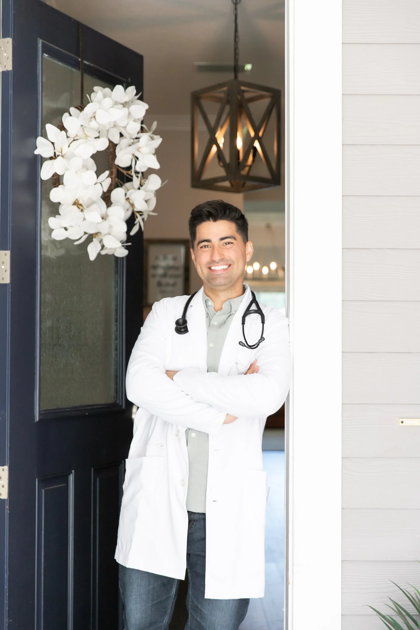 Urgent care doctor in home visits in doorway for website content