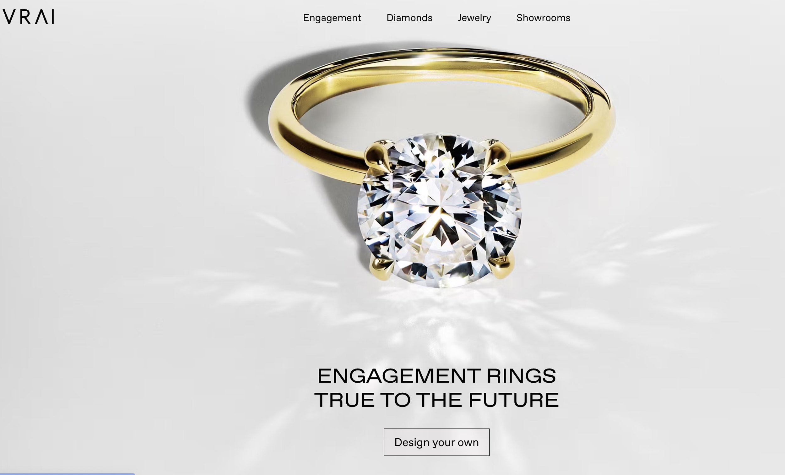 A screenshot from the VRAI homepage featuring a solitaire oval engagement ring and fine jewelry digital marketing