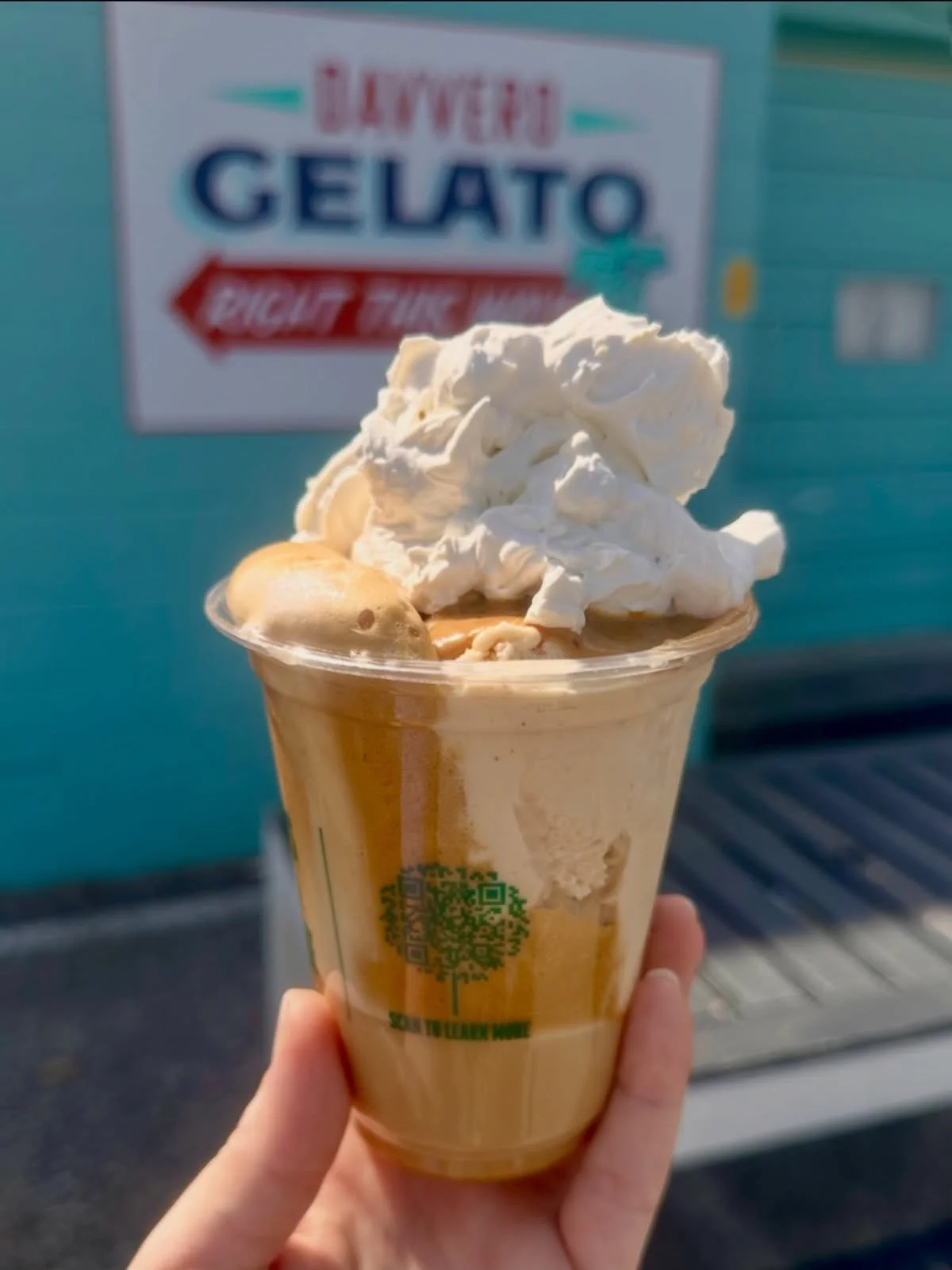 Peanut Butter Frapogato- Peanut Butter gelato drowned in Greek style whipped coffee and a splash of oat milk, topped with salty peanut butter drizzle and fresh whip