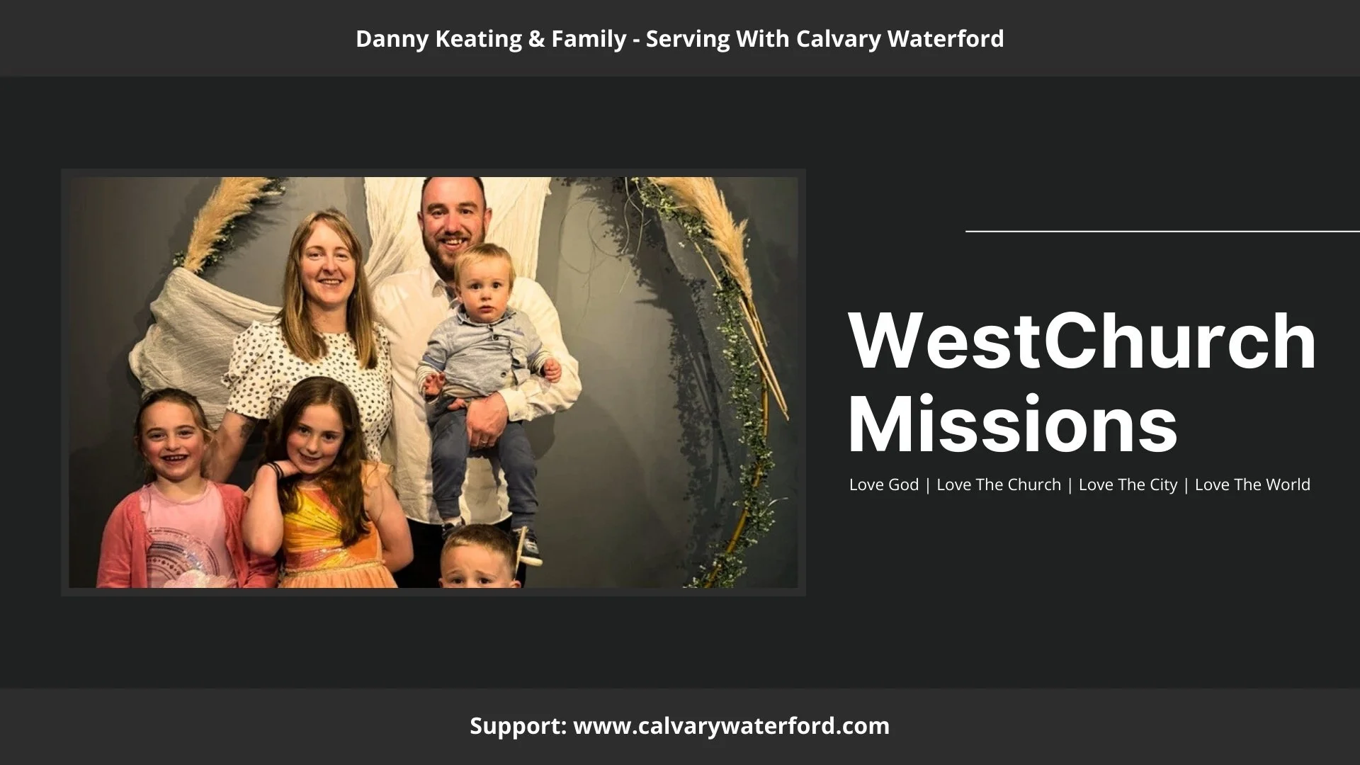 A family of six, including two adults and four children, posing for a photo at WestChurch Missions event, with decorative arch in the background.