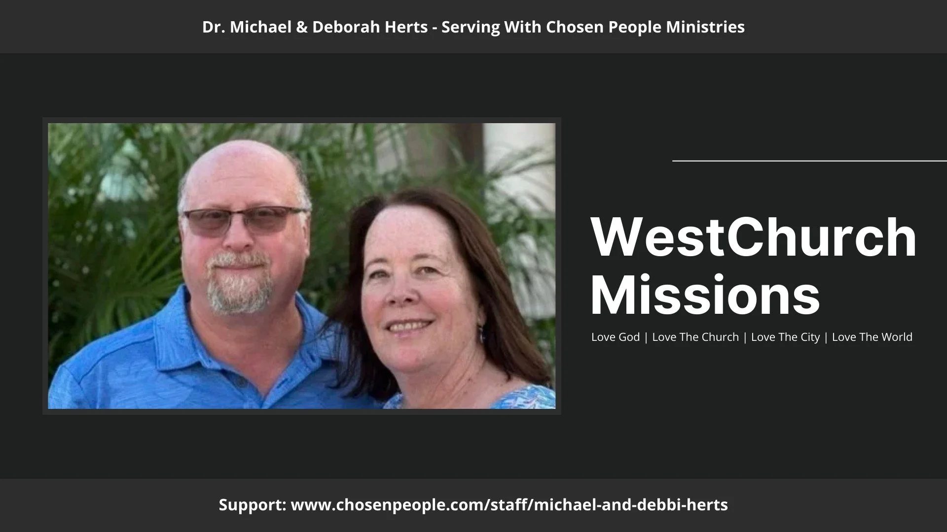 Photo of a man with glasses and a woman, both smiling, standing outdoors with greenery in the background.