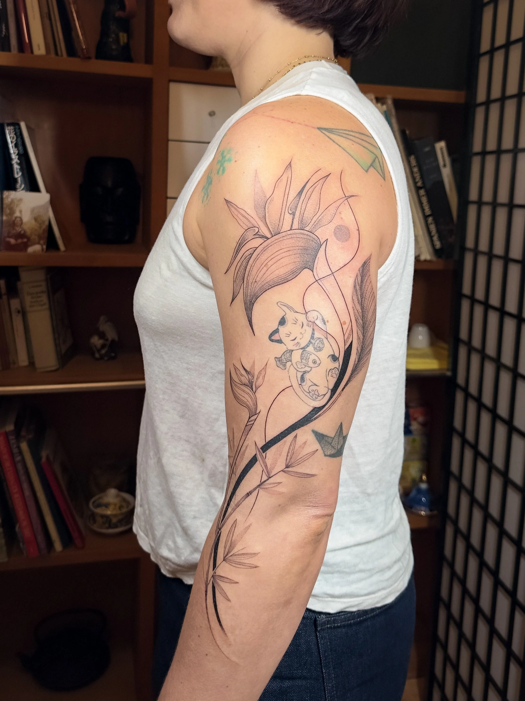 Fine line botanical tattoo created to integrate and enhance an existing piece. Flowing bird of paradise elements and soft shading bring harmony, movement, and balance to the overall composition.

Botanical work by Lis Roldan.
