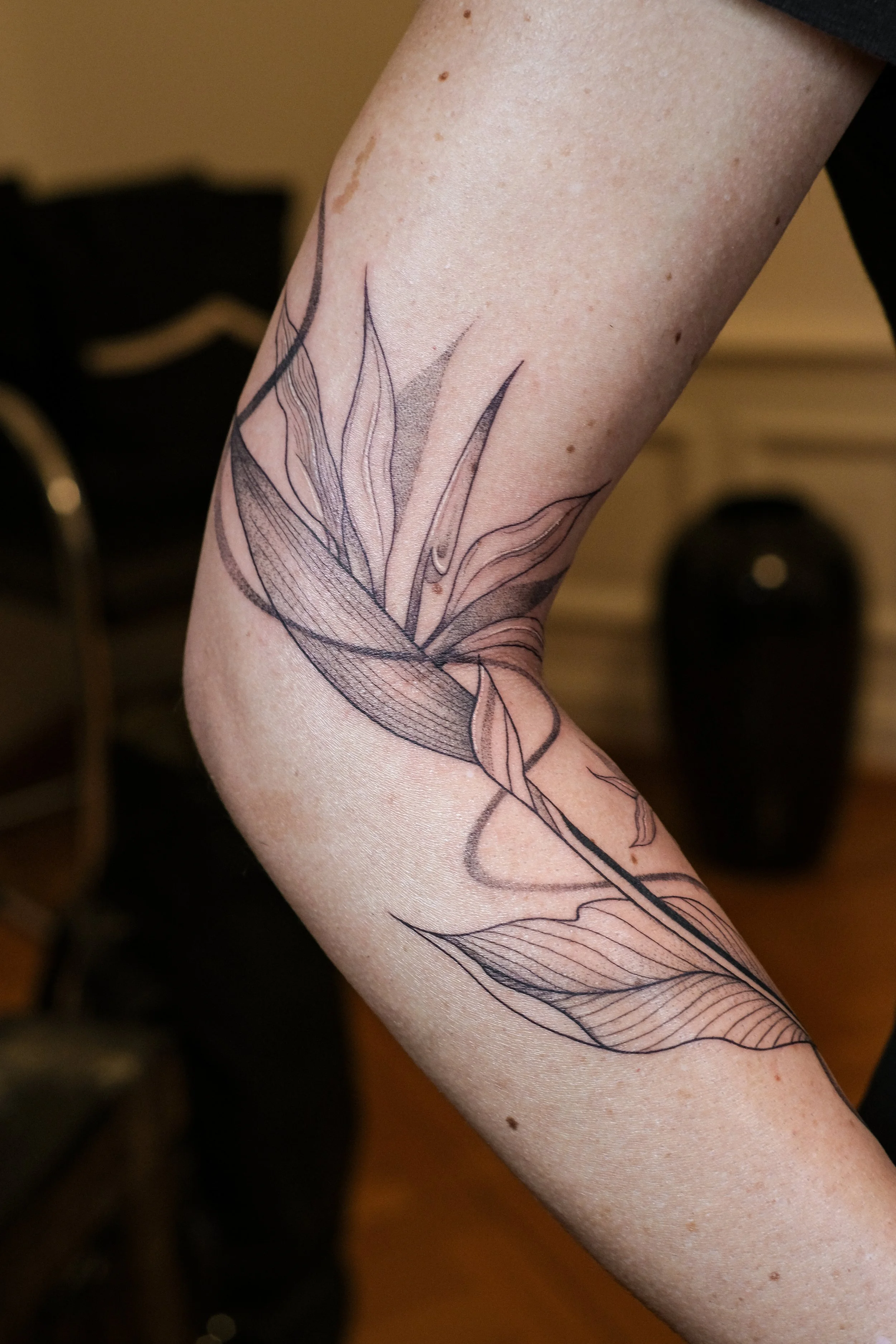 bird-of-paradise-flower-arm-tattoo-lis-roldan.jpg