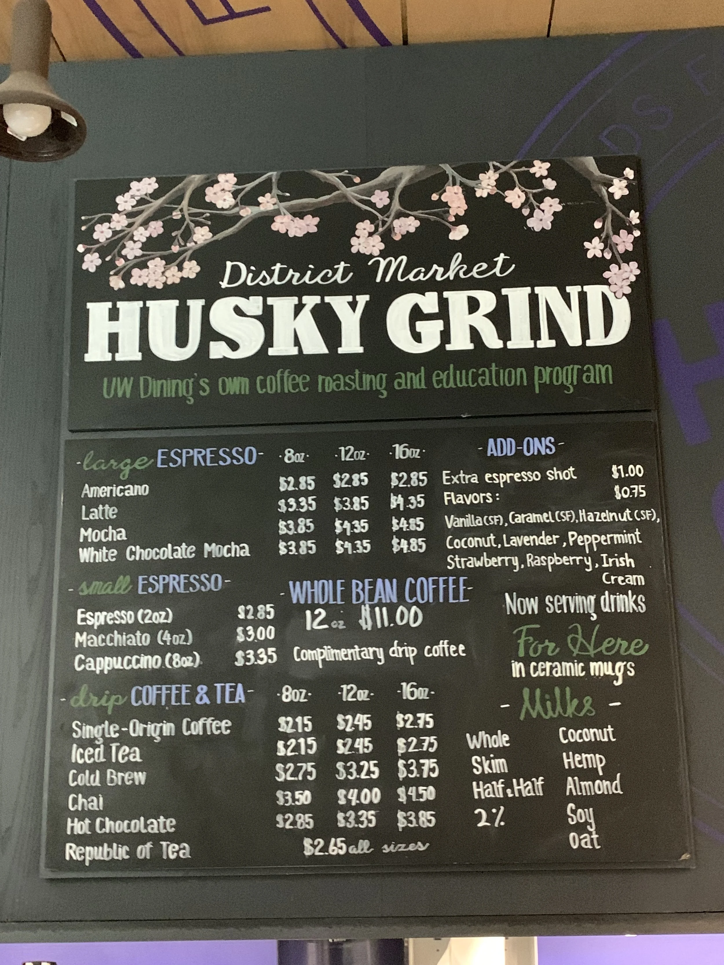 Menu board design for Husky Grind coffee shop, organizing espresso, drip coffee, and add-ons with clear hierarchy and hand-lettered styling.