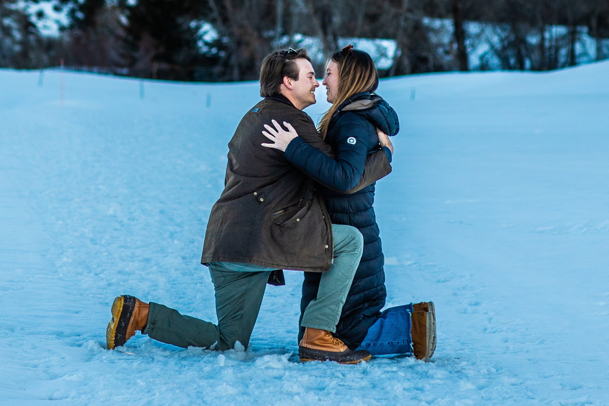  Discover the enchantment of a surprise engagement on Beaver Creek's snow-kissed golf course in Colorado. Follow Emily and Conner's heartwarming journey as they navigate the snowy landscape, culminating in a spontaneous proposal. The stunning mountai