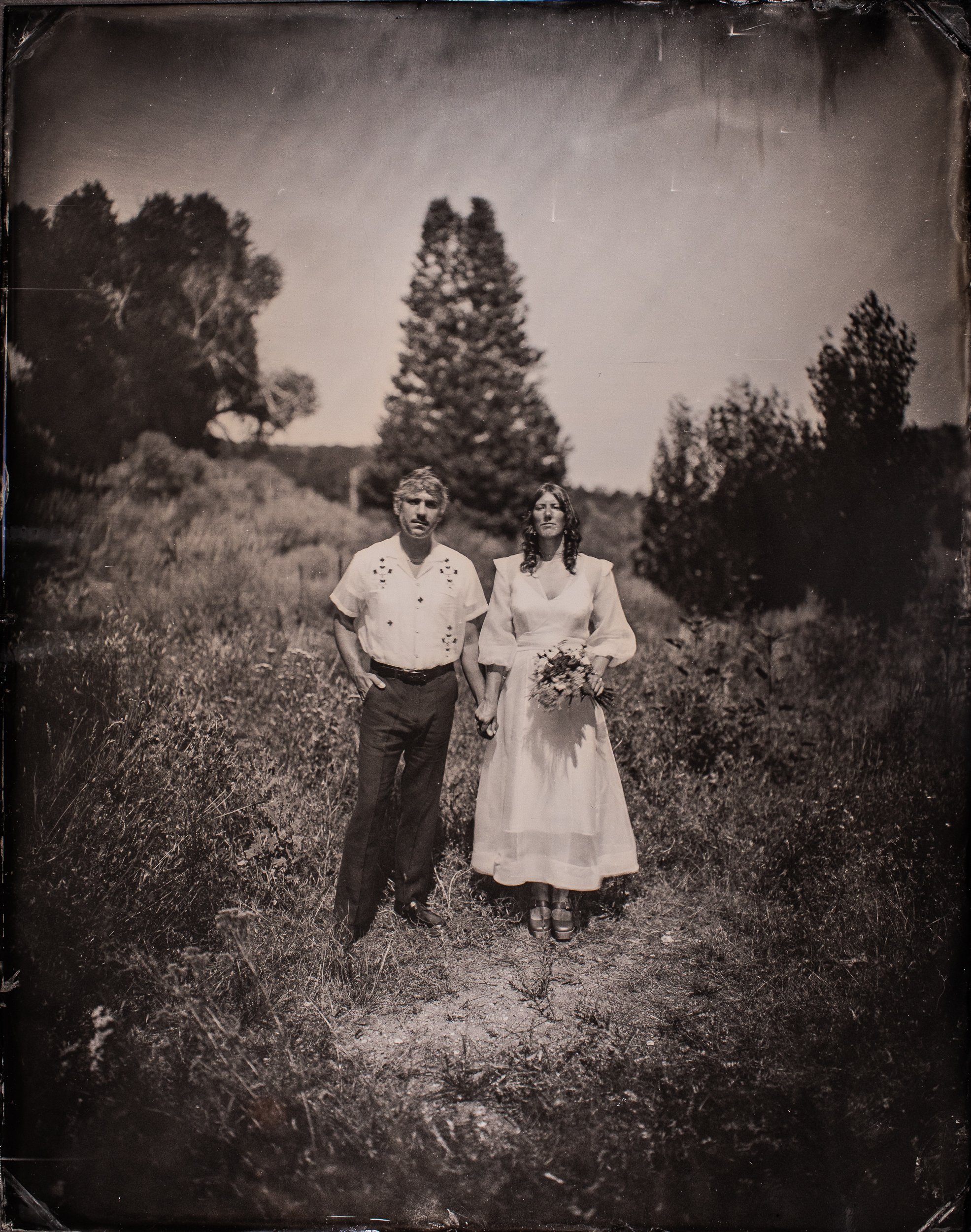 Bride and groom make tintype at a wedding in New Mexico