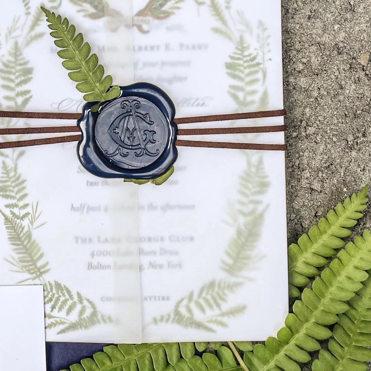 custom wax seals with a pop of greenery 🌿 these ferns were plucked from the riverbank right outside our studio, hand-pressed and delicately positioned on every invitation🫶🏼
.
.
.
.
#customwaxseal #waxsealstamp #artisaire #pressedflowers #birchbark