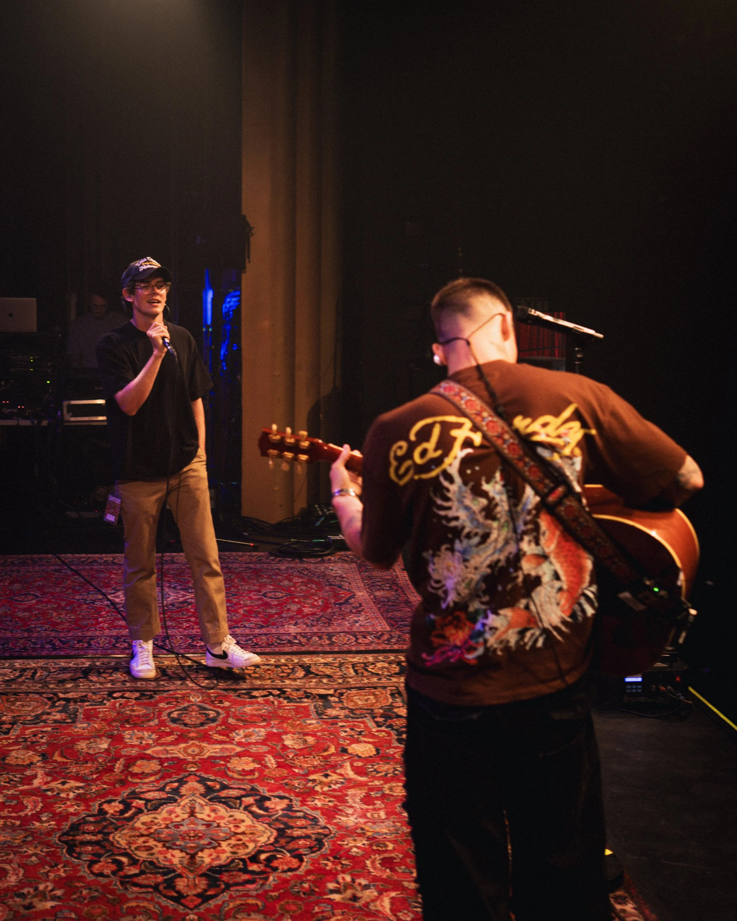 Sound check with two musicians practicing ahead of a live show